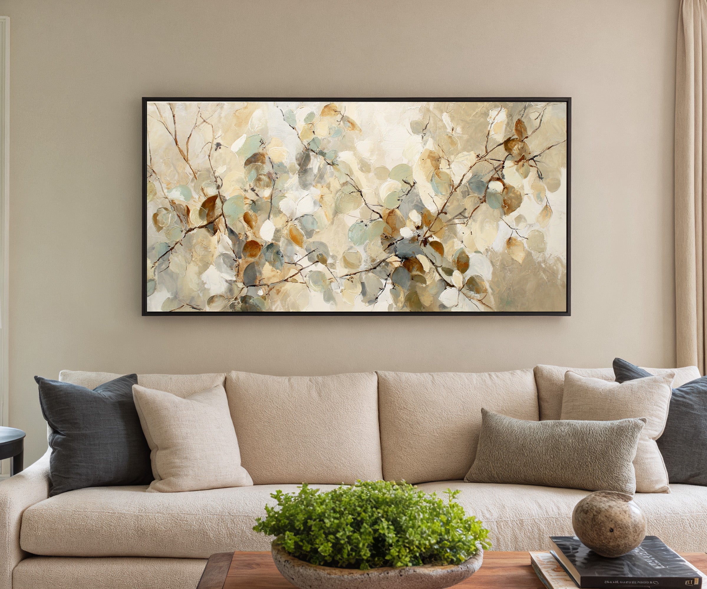 soft eucalyptus leaves in cream, sage, blue canvas wall art in a black frame in a styled room setting