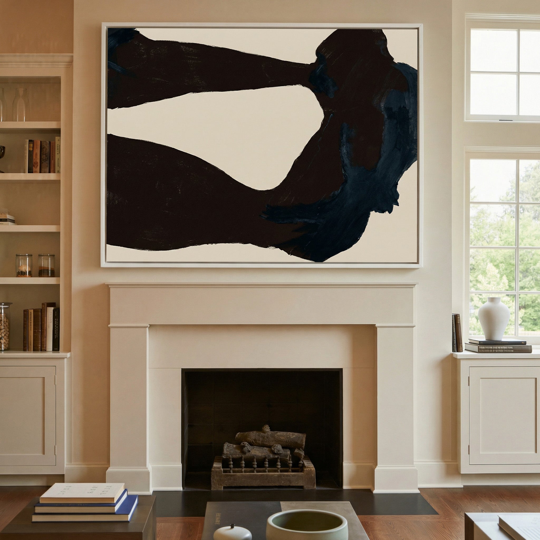 dark charcoal and deep blue abstract with broad canvas wall art in a white frame above a mantel