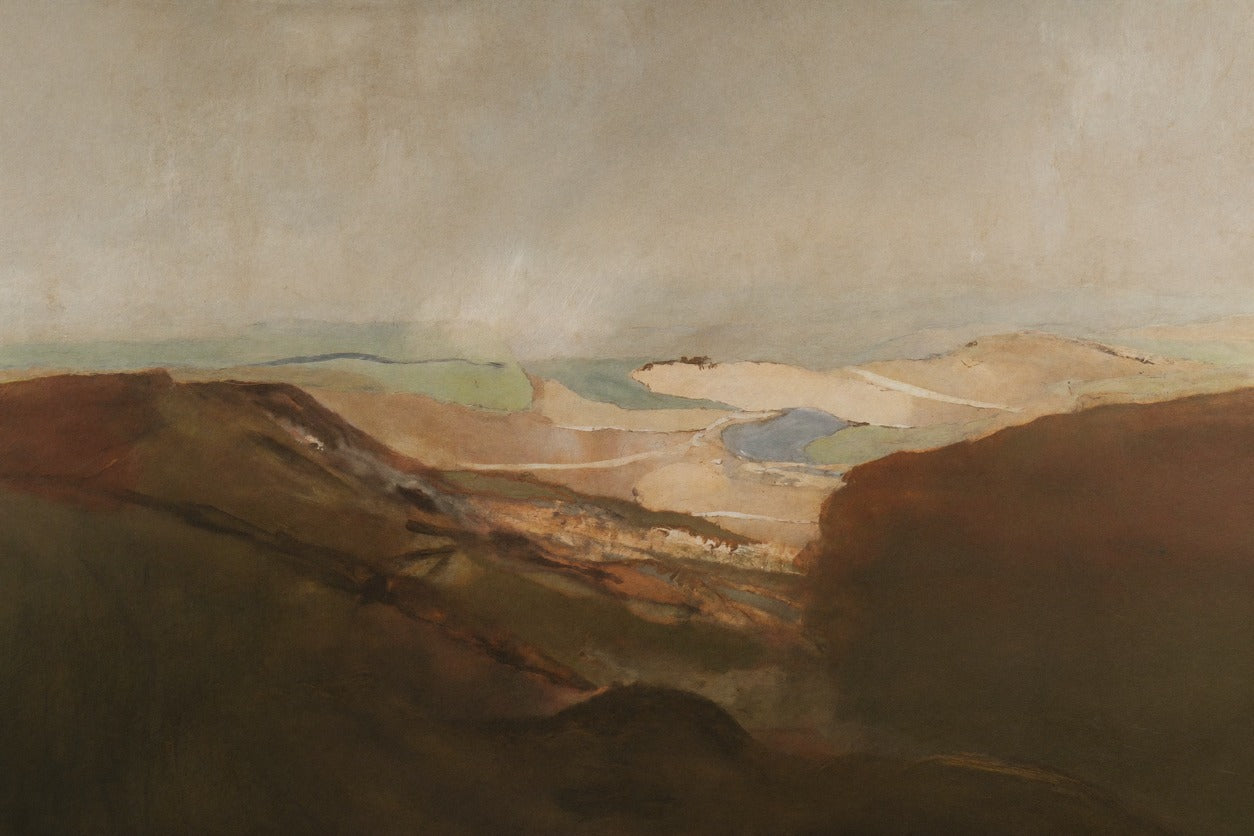Layered desert dunes and a pale basin in brown, sage, and muted blue-gray