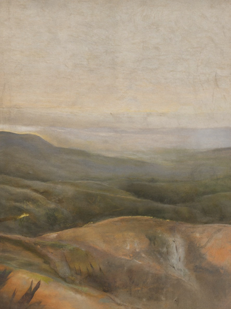 Layered olive and ochre hills under a pale beige sky with soft low ridges