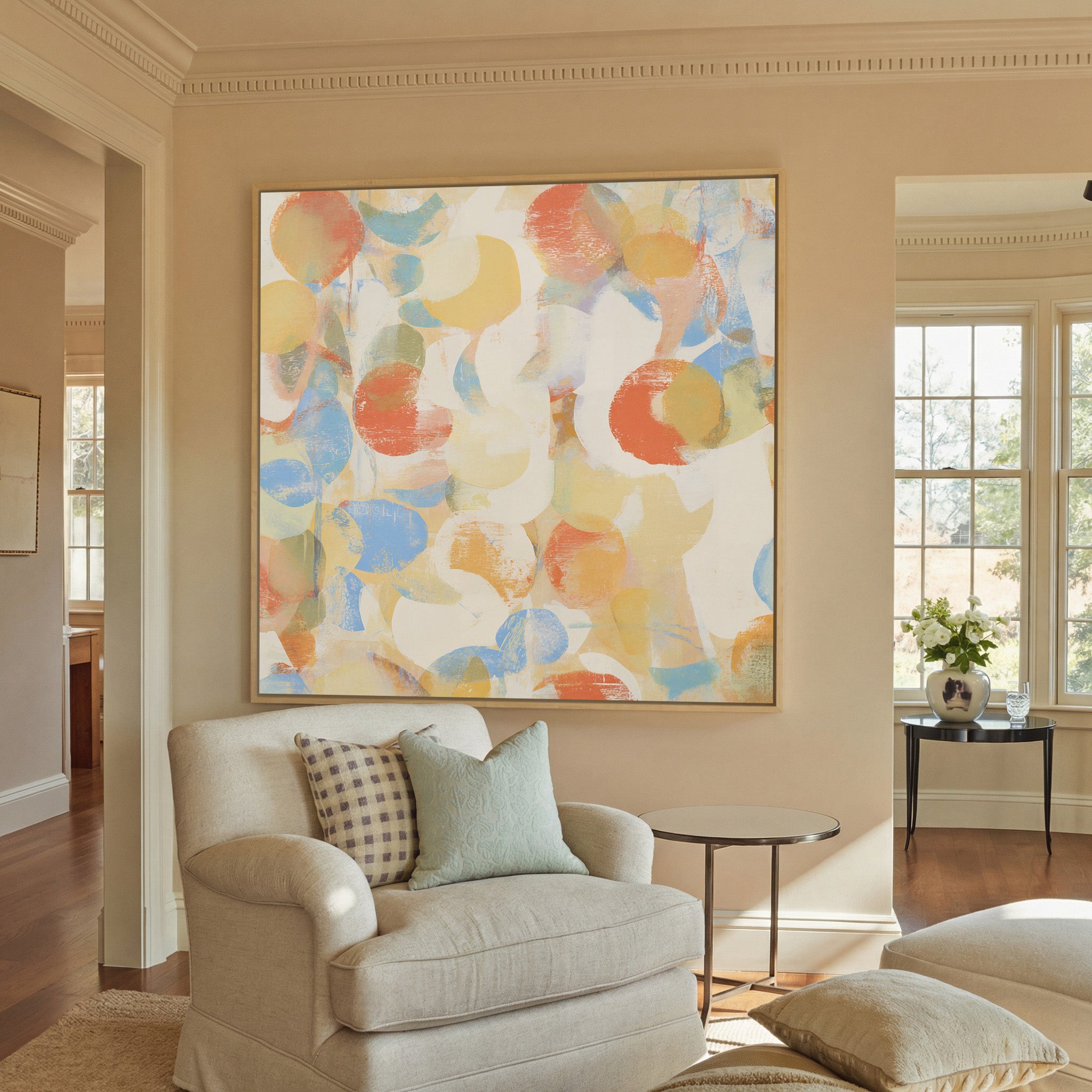 soft pastel circle abstract canvas wall art in a natural wood frame in a styled room setting