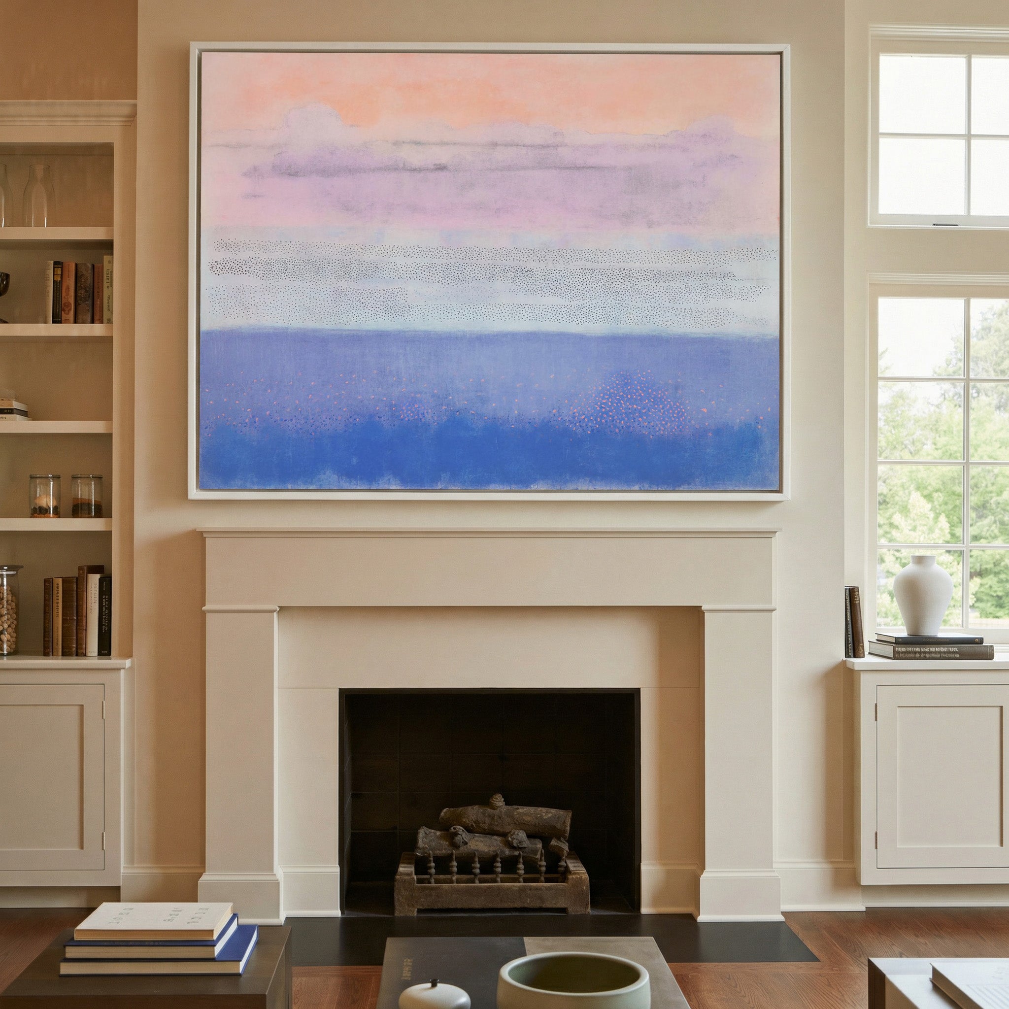 soft peach, lavender, and blue abstract canvas wall art in a white frame above a mantel