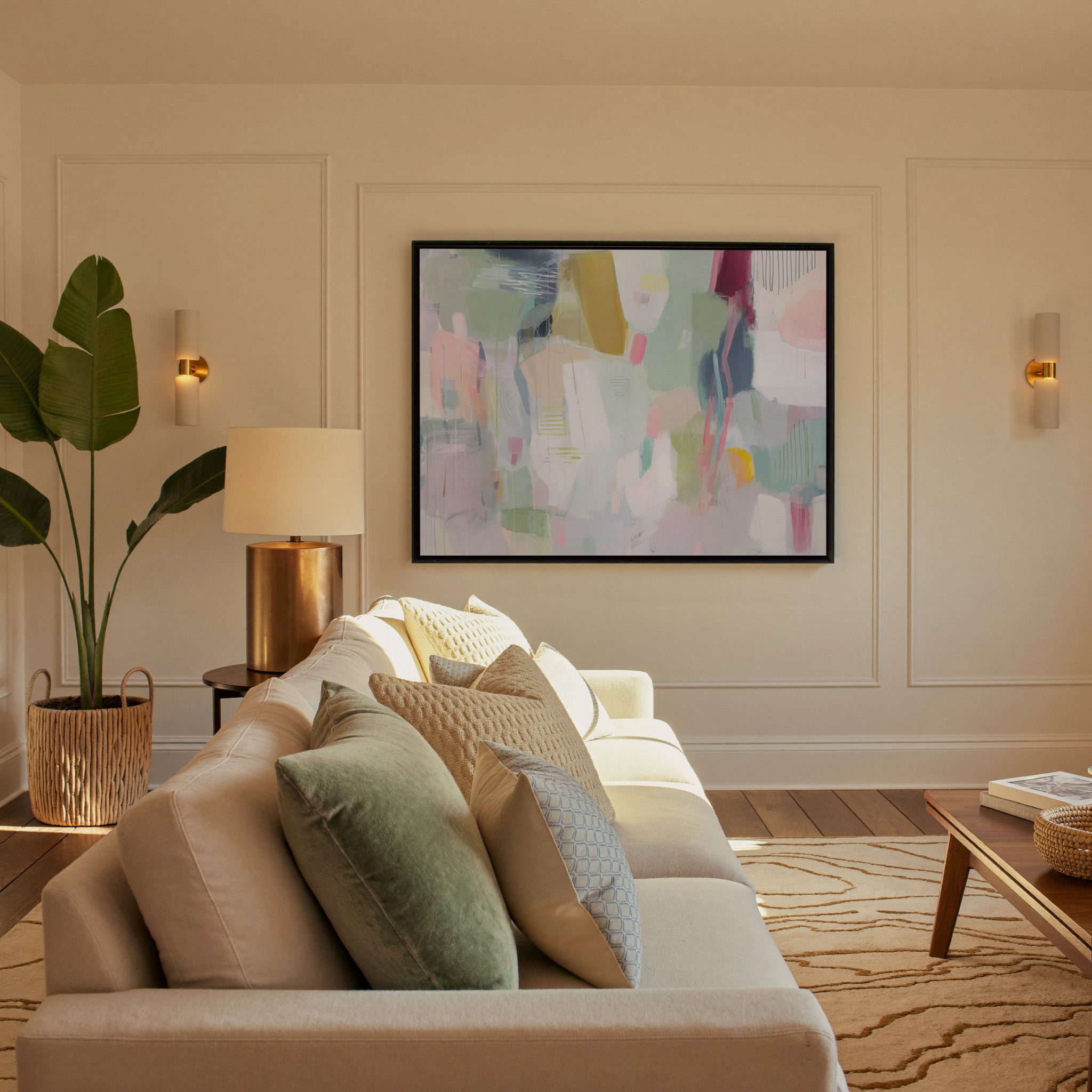 soft pastel abstract with vertical marks and canvas wall art in a black frame in a styled room setting