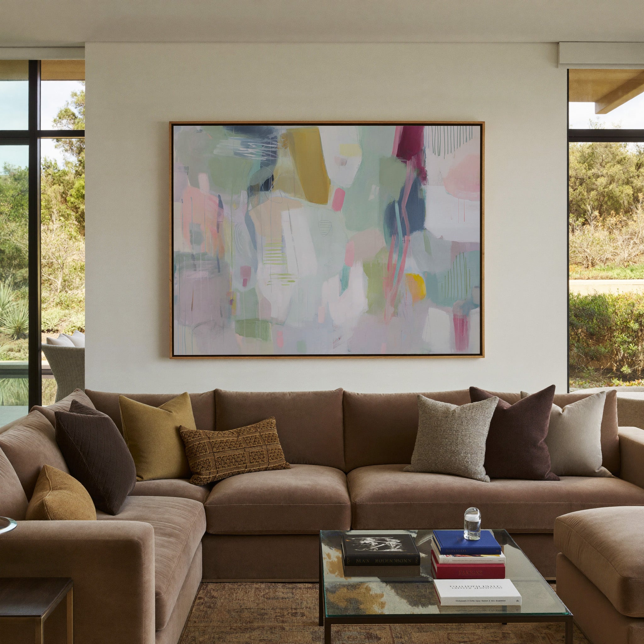 soft pastel abstract with vertical marks and canvas wall art in an oak frame in a styled room setting