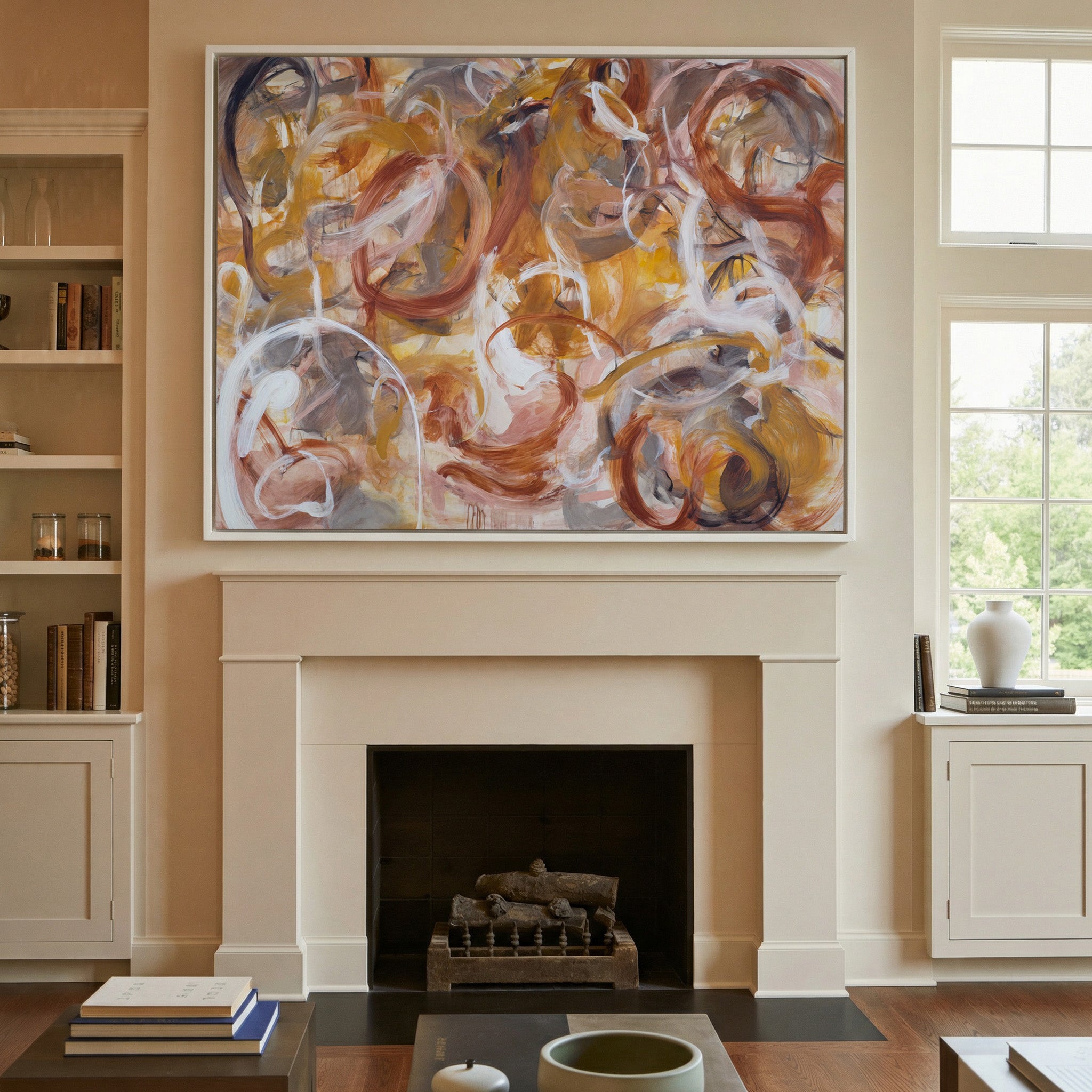 warm rust, gold, cream, and gray abstract with canvas wall art in a white frame above a mantel