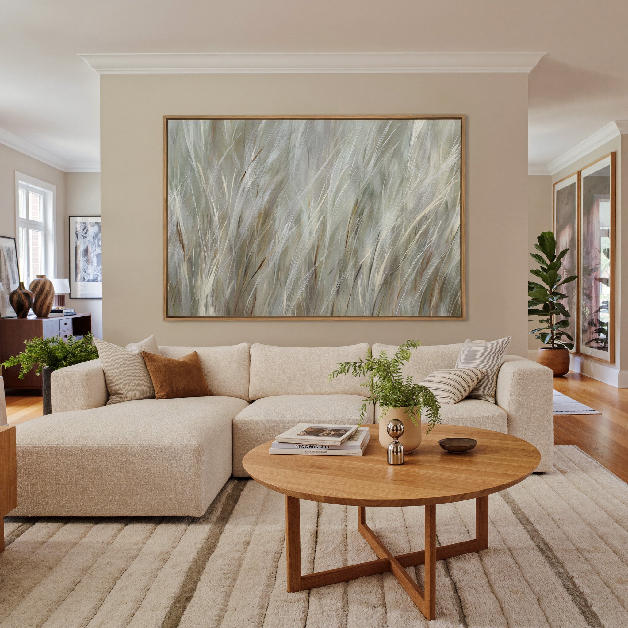 soft beige and cream grass blades canvas wall art in an oak frame in a living room