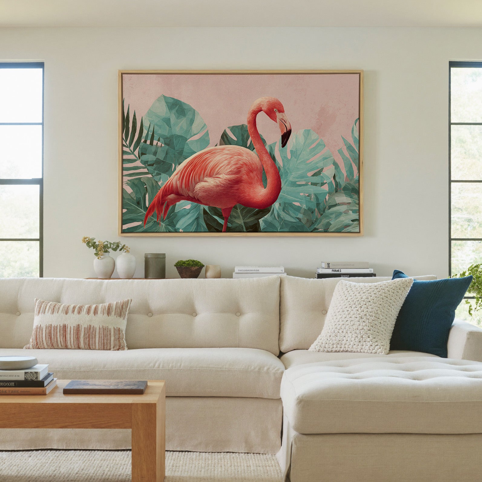 pink flamingo among teal tropical leaves canvas wall art in a natural wood frame in a living room