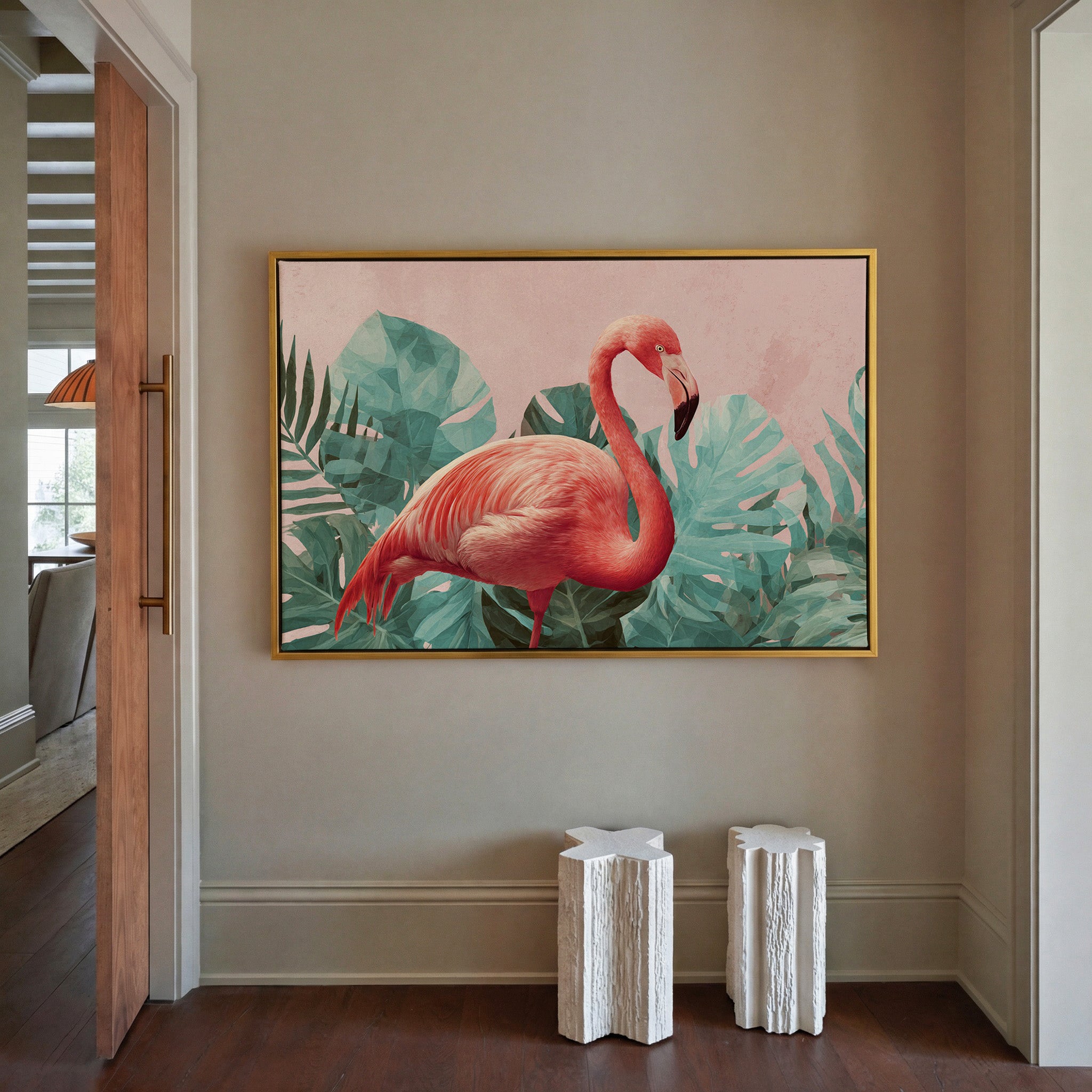 pink flamingo among teal tropical leaves canvas wall art in a gold frame in a styled room setting