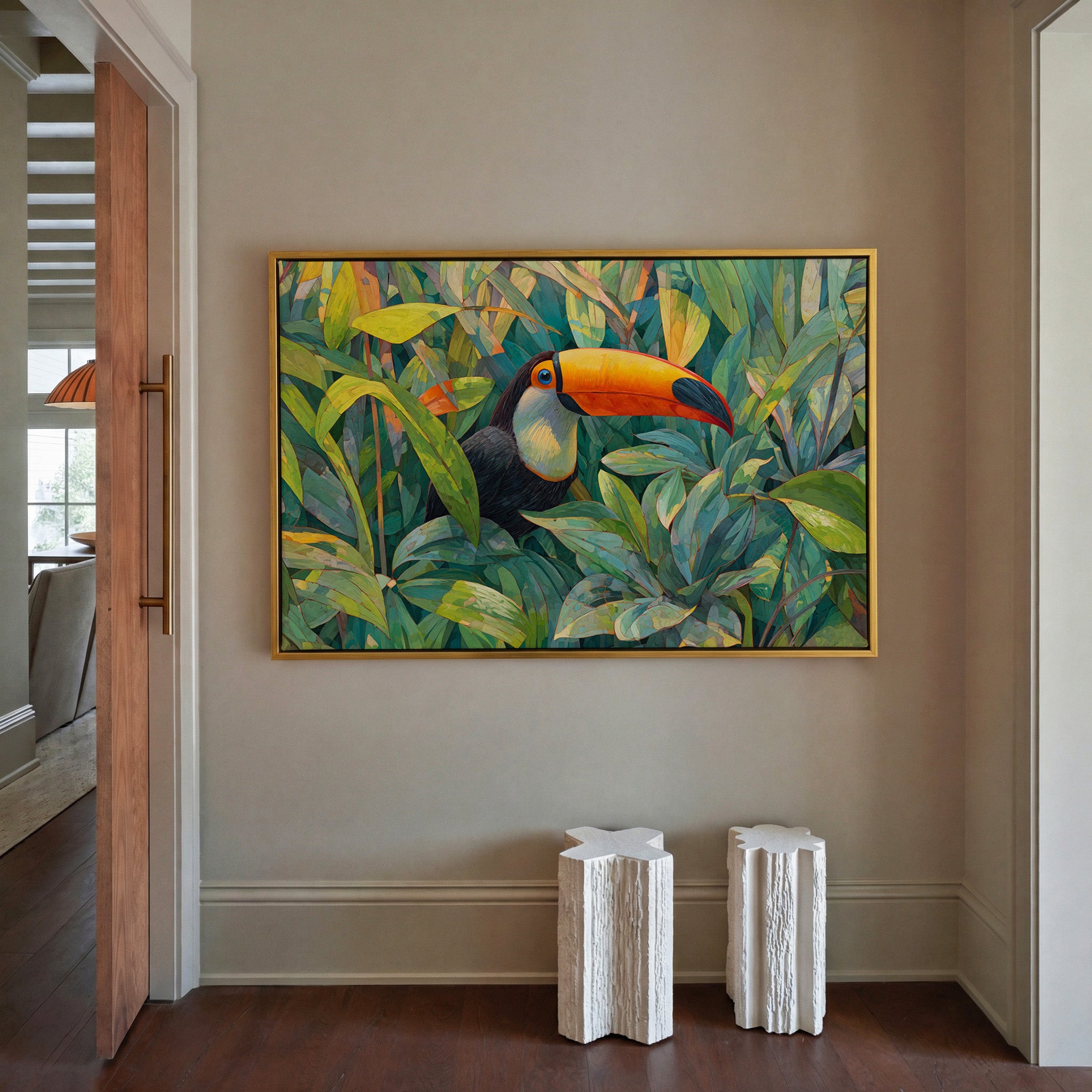 toucan in dense tropical foliage canvas wall art in a gold frame in a styled room setting