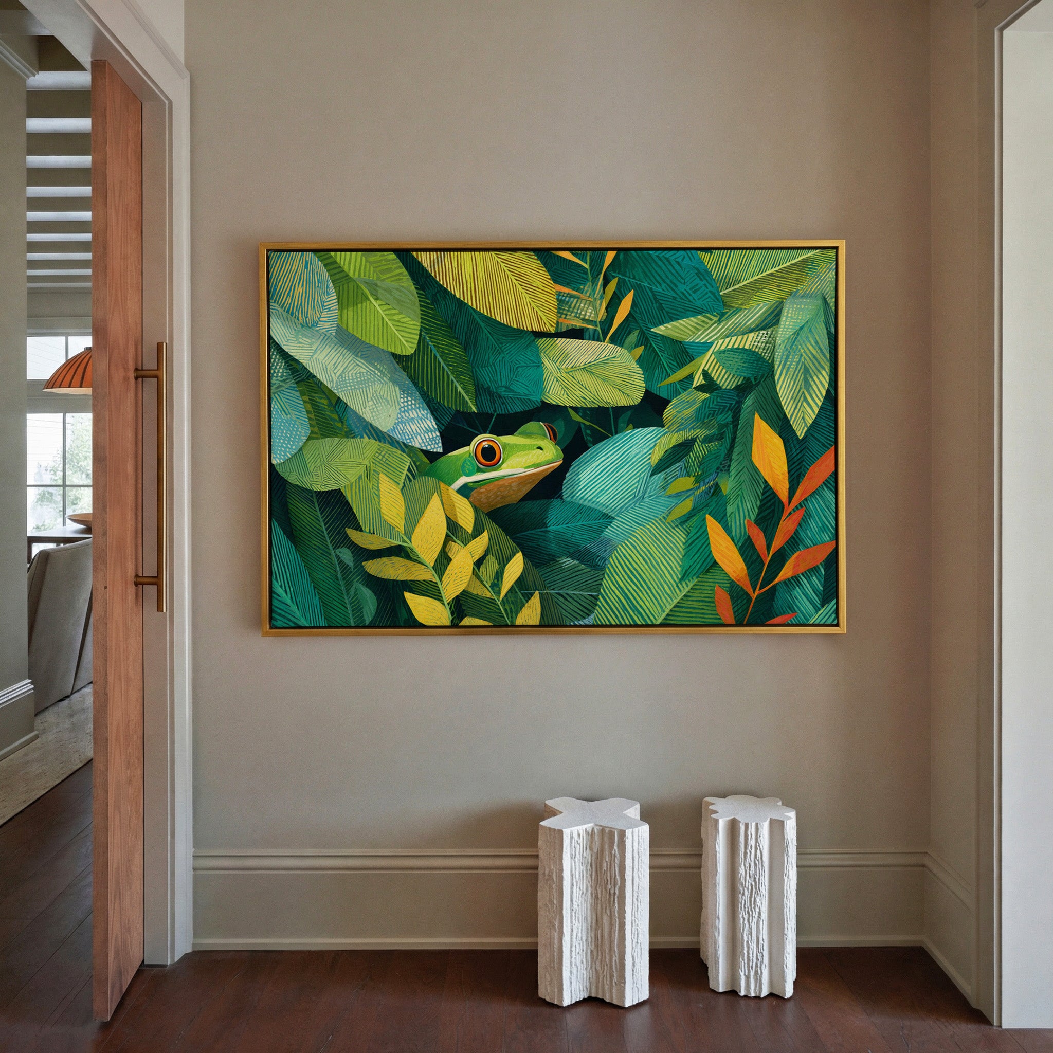 green frog among layered tropical leaves canvas wall art in a gold frame in a styled room setting