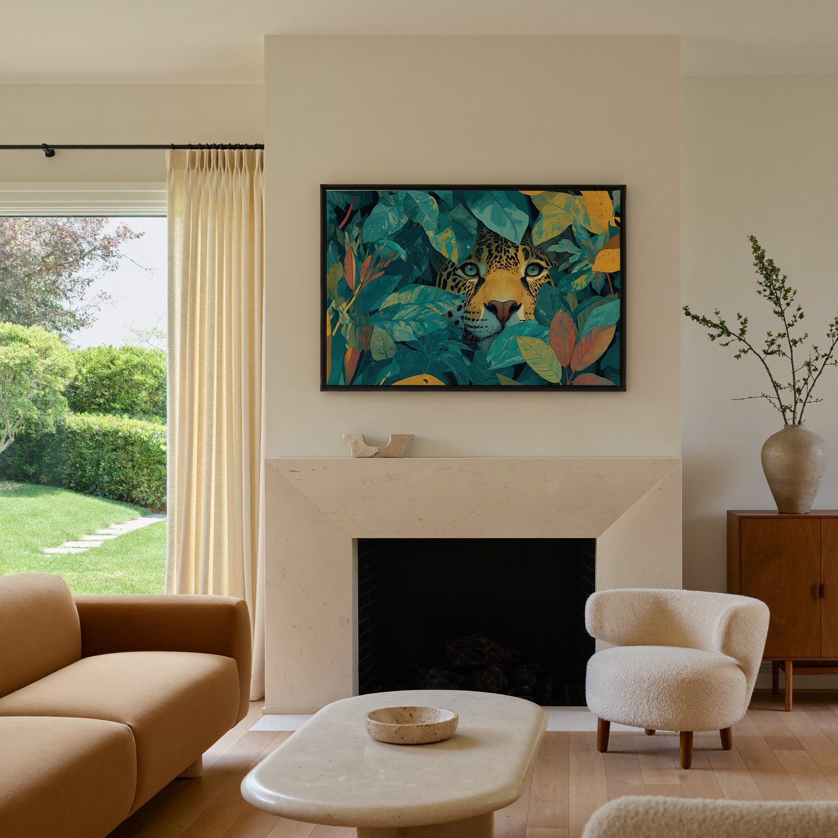 leopard face framed by teal leaves and gold canvas wall art in a black frame above a mantel