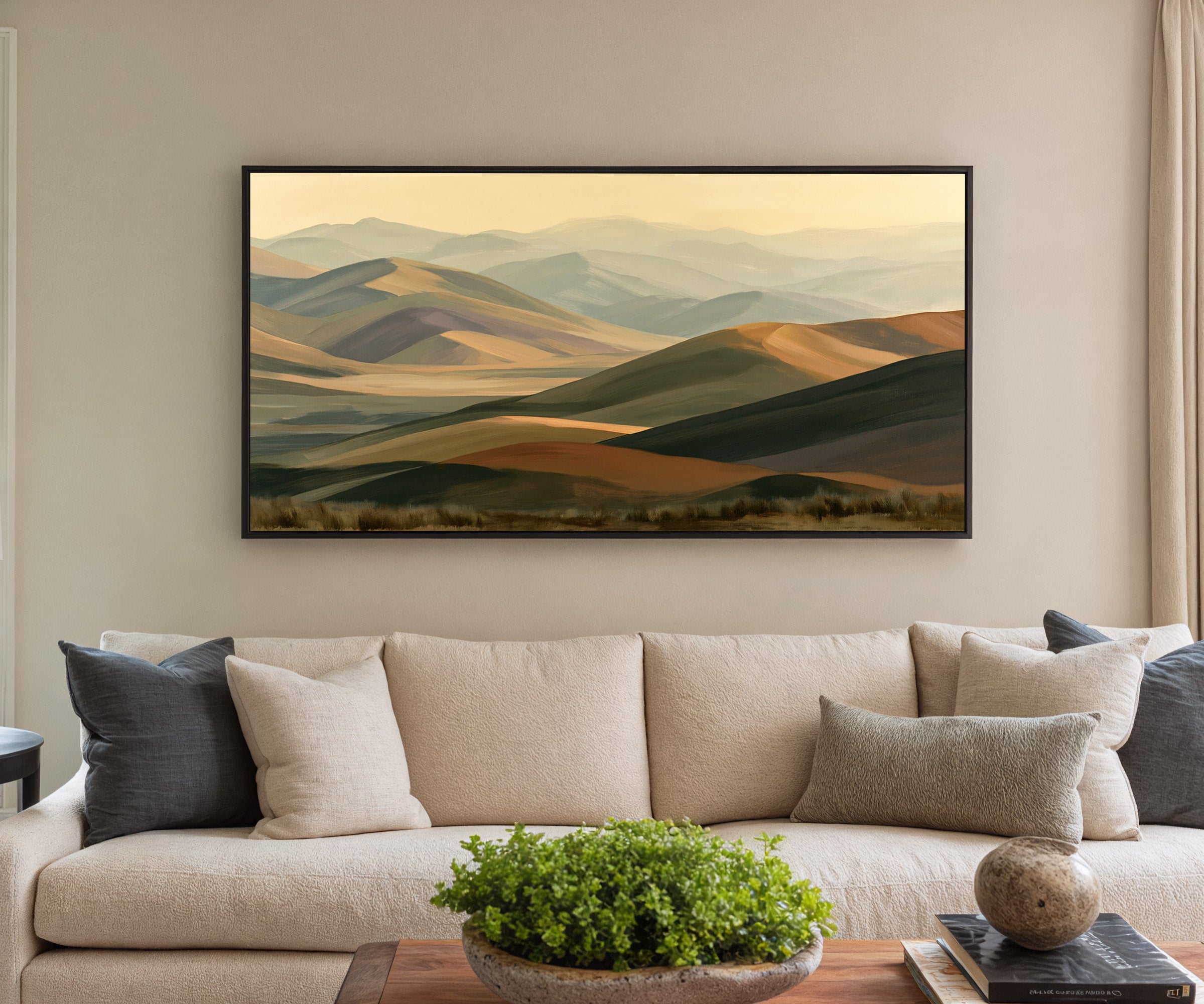 layered mountain ridges in muted gold and sage canvas wall art in a black frame in a styled room setting