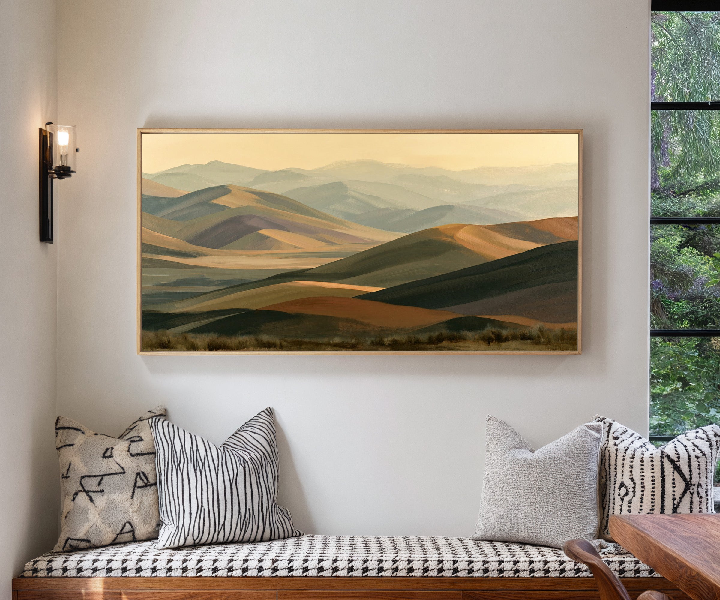 layered mountain ridges in muted gold and sage canvas wall art in a natural wood frame in a living room