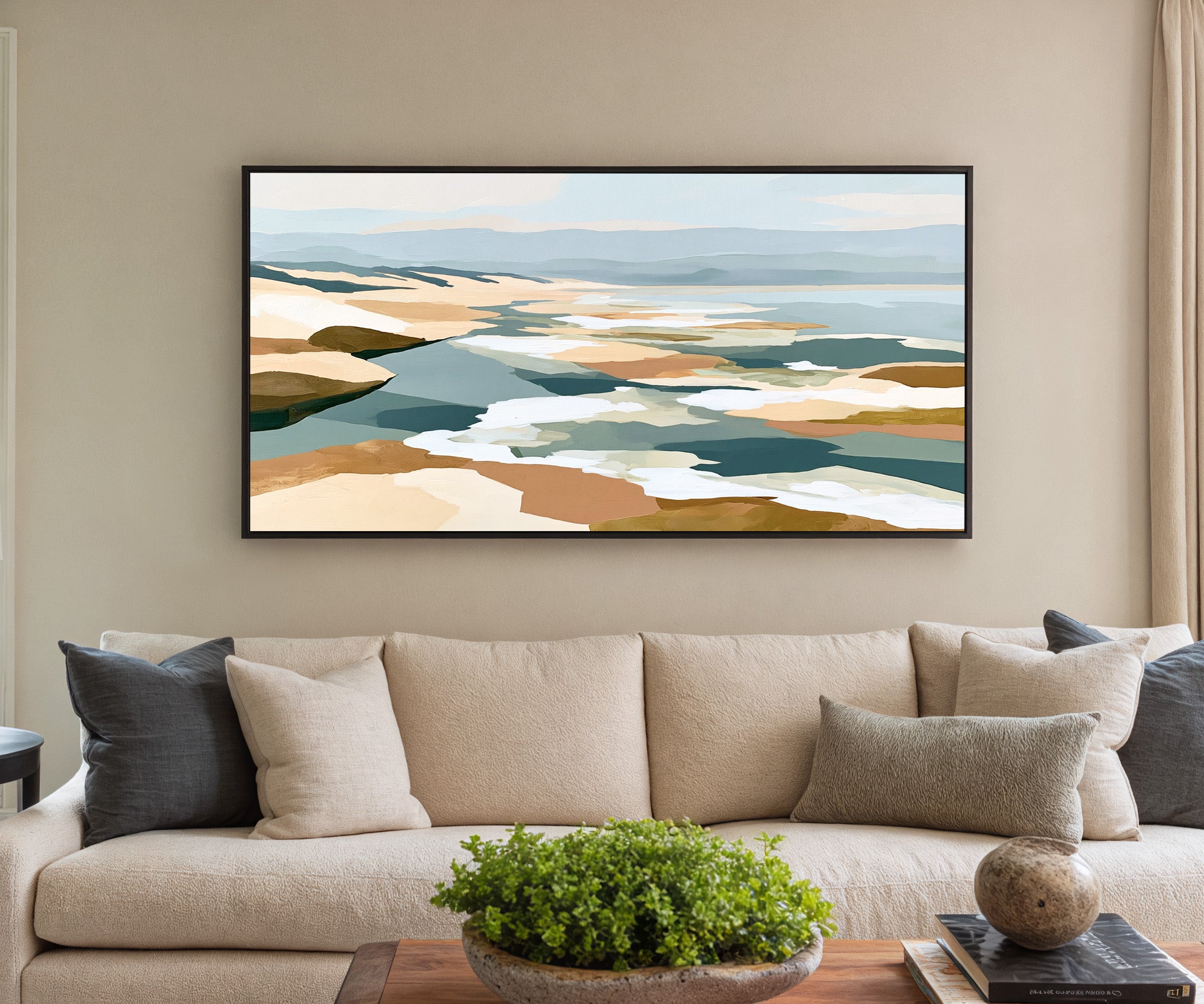 layered sandbars and blue water abstract canvas wall art in a black frame in a styled room setting