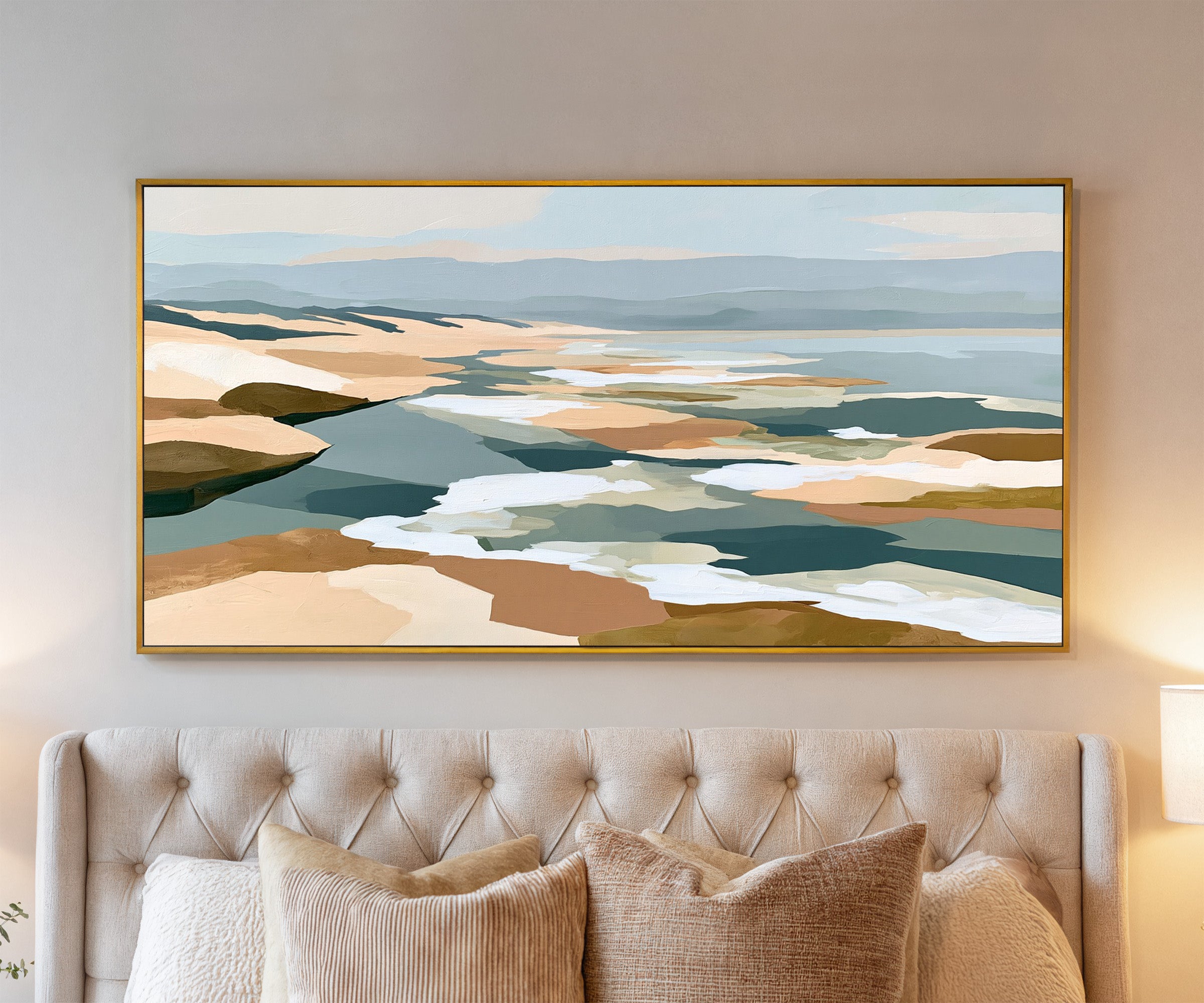 layered sandbars and blue water abstract canvas wall art in a gold frame above a bed