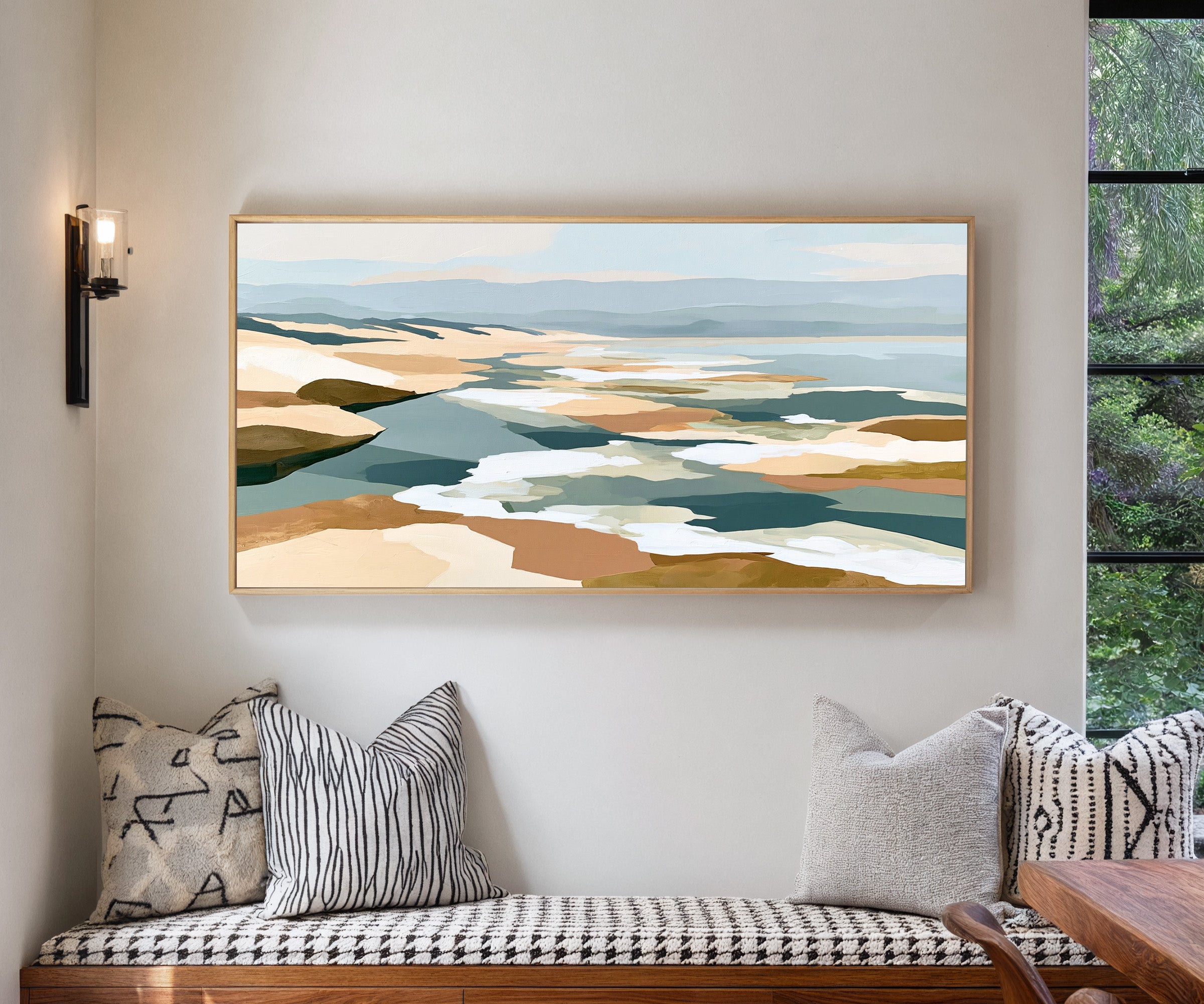 layered sandbars and blue water abstract canvas wall art in a natural wood frame in a living room