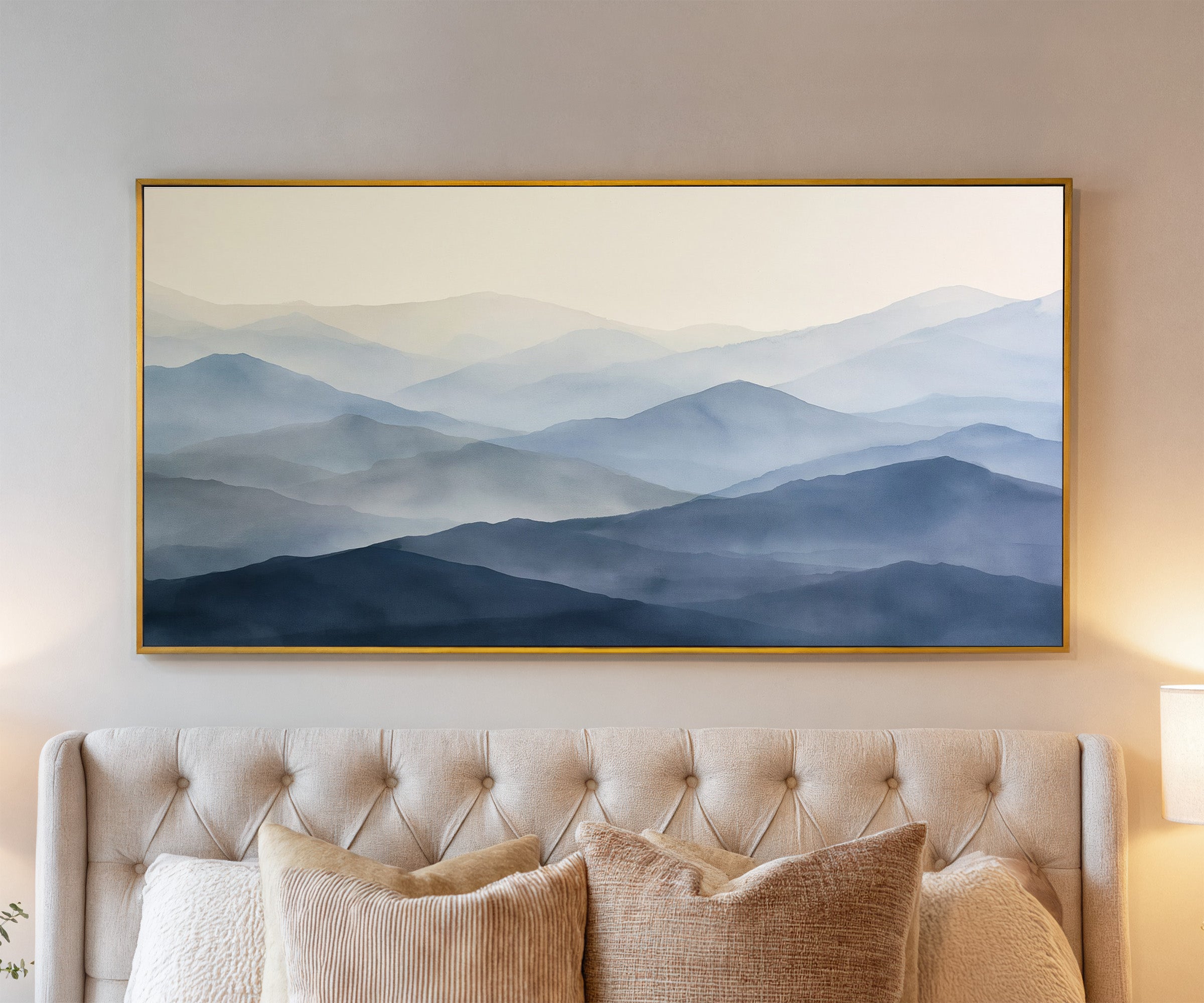 soft blue mountain layers canvas wall art in a gold frame above a bed, with clear frame and room context