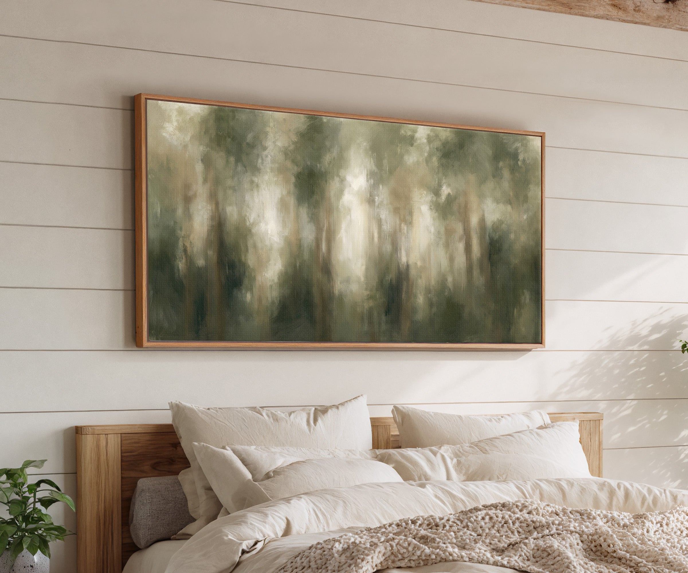 soft green and beige abstract forest canvas wall art in an oak frame above a bed