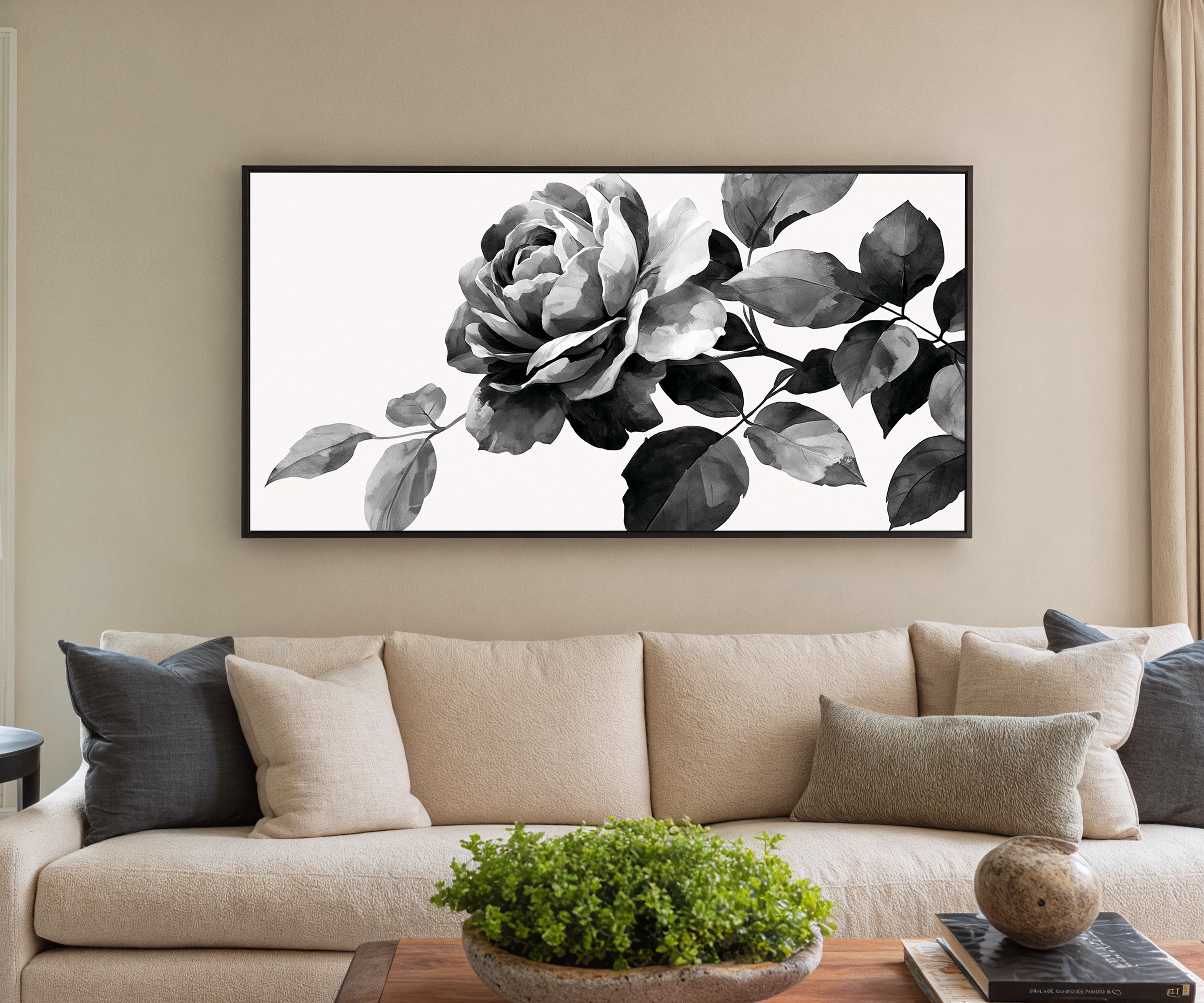 black and white floral branch canvas wall art in a black frame in a styled room setting