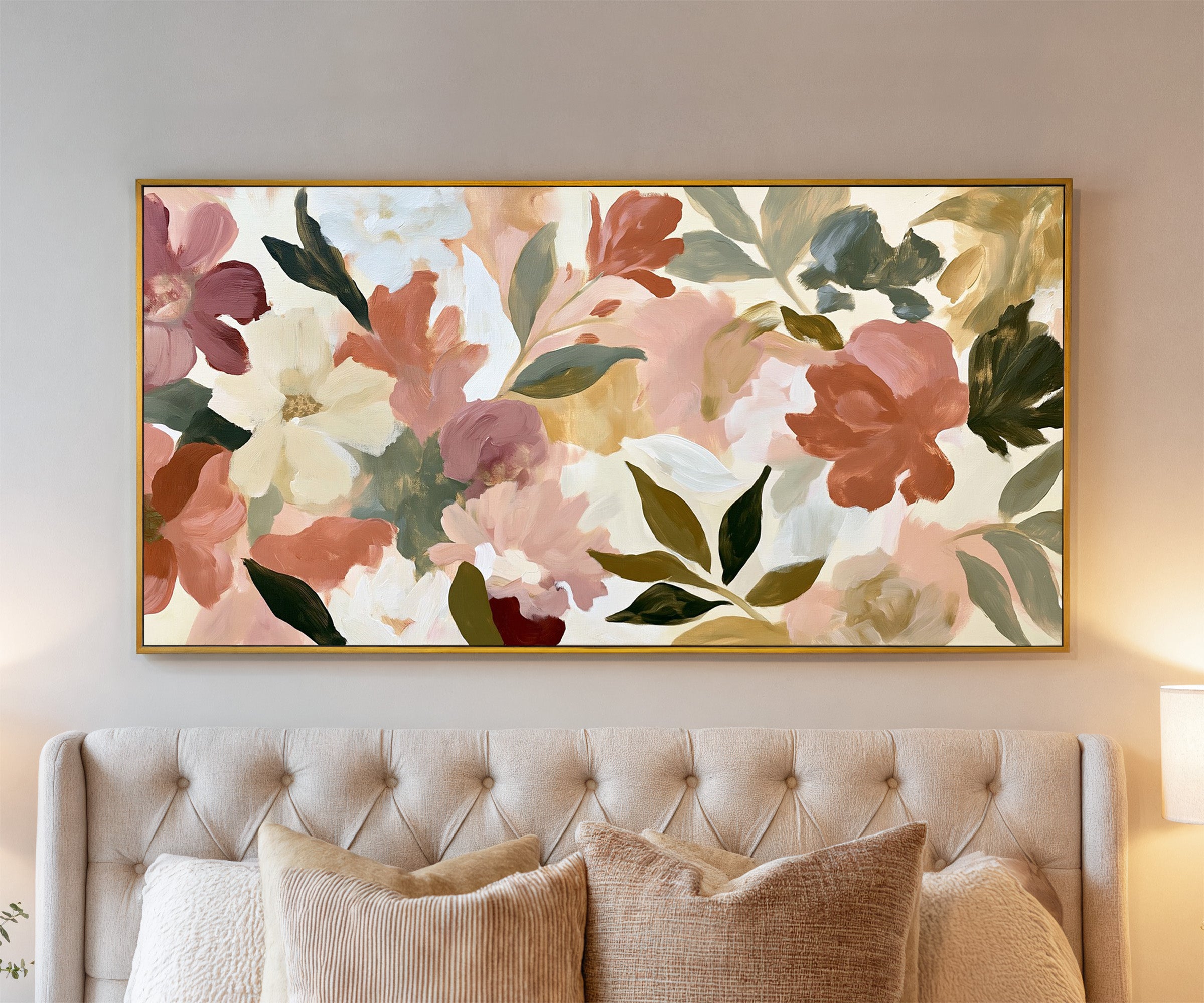 soft blush, cream, and terracotta floral forms canvas wall art in a gold frame above a bed