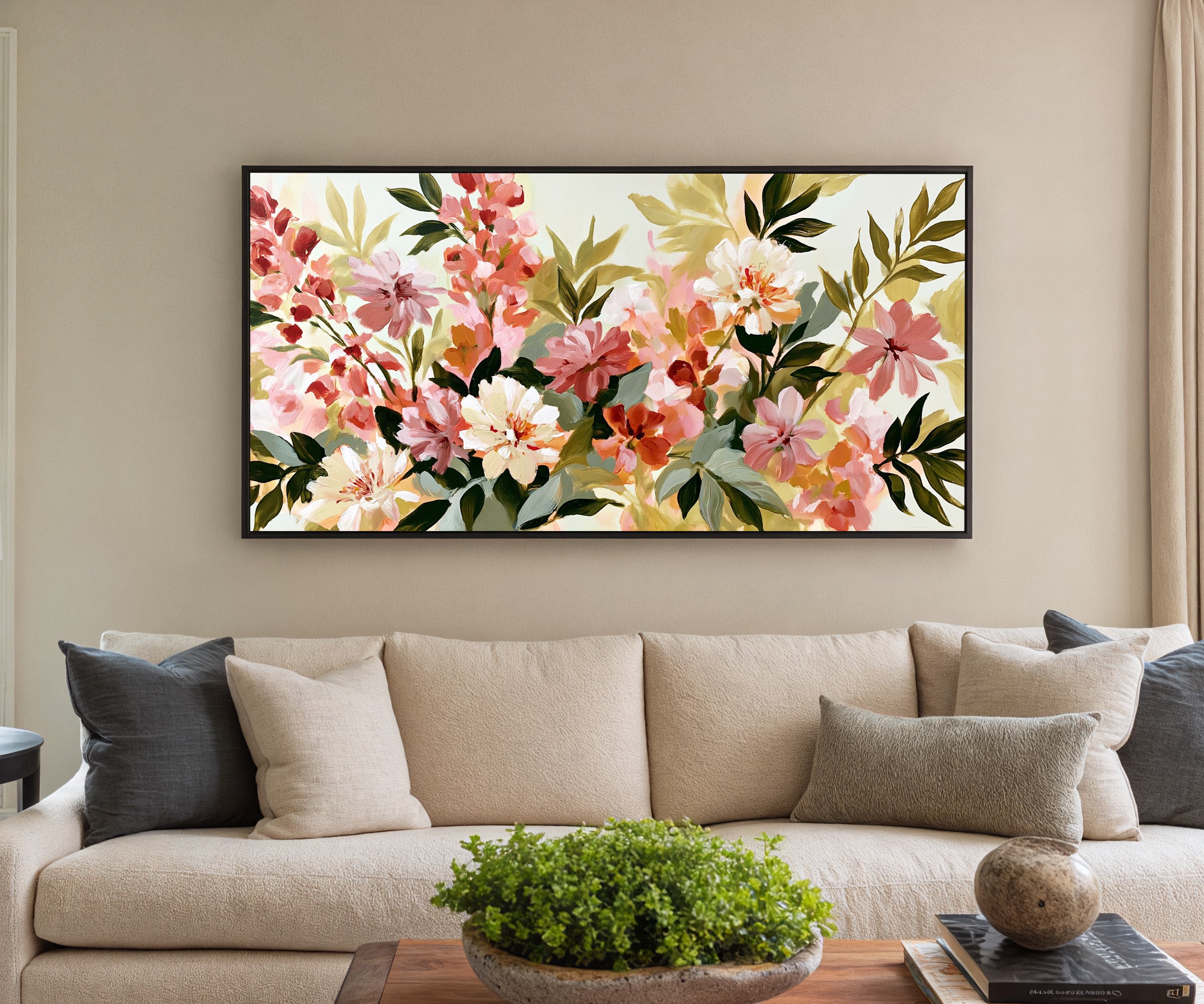soft pink, cream, and olive floral forms canvas wall art in a black frame in a styled room setting