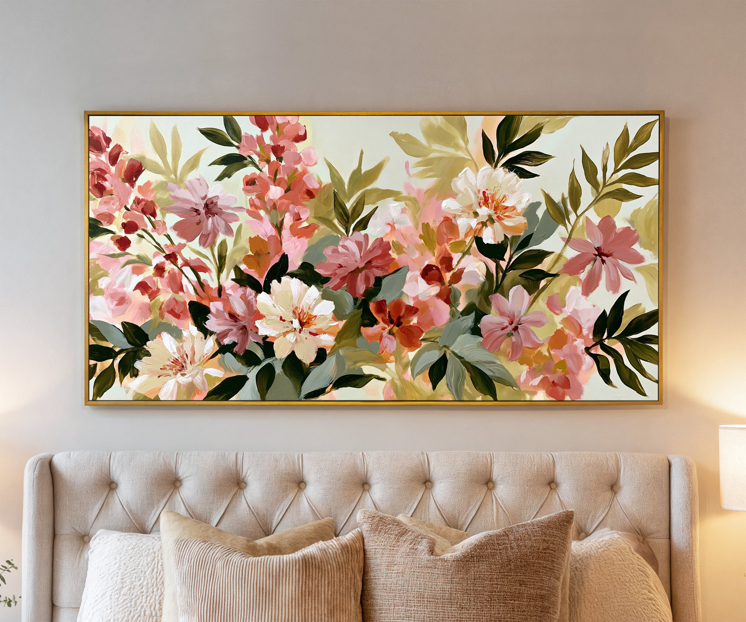 soft pink, cream, and olive floral forms canvas wall art in a gold frame above a bed