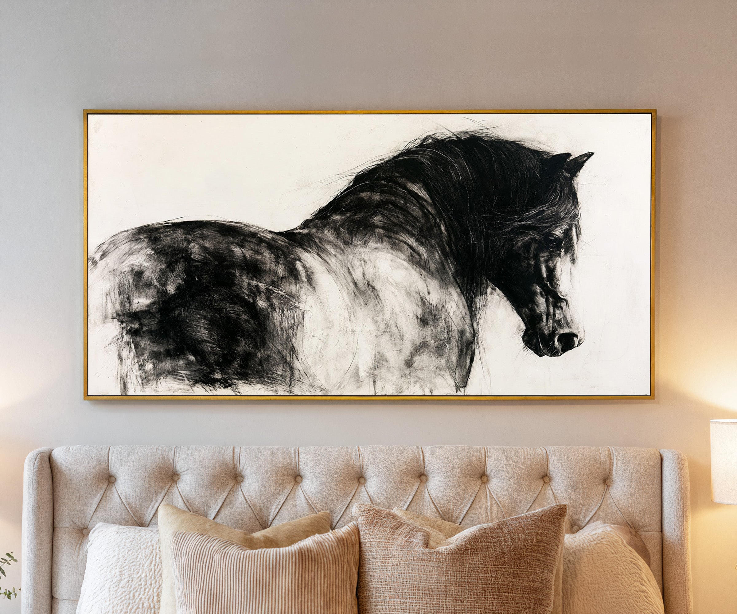 black and white close cropped horse portrait canvas wall art in a gold frame above a bed