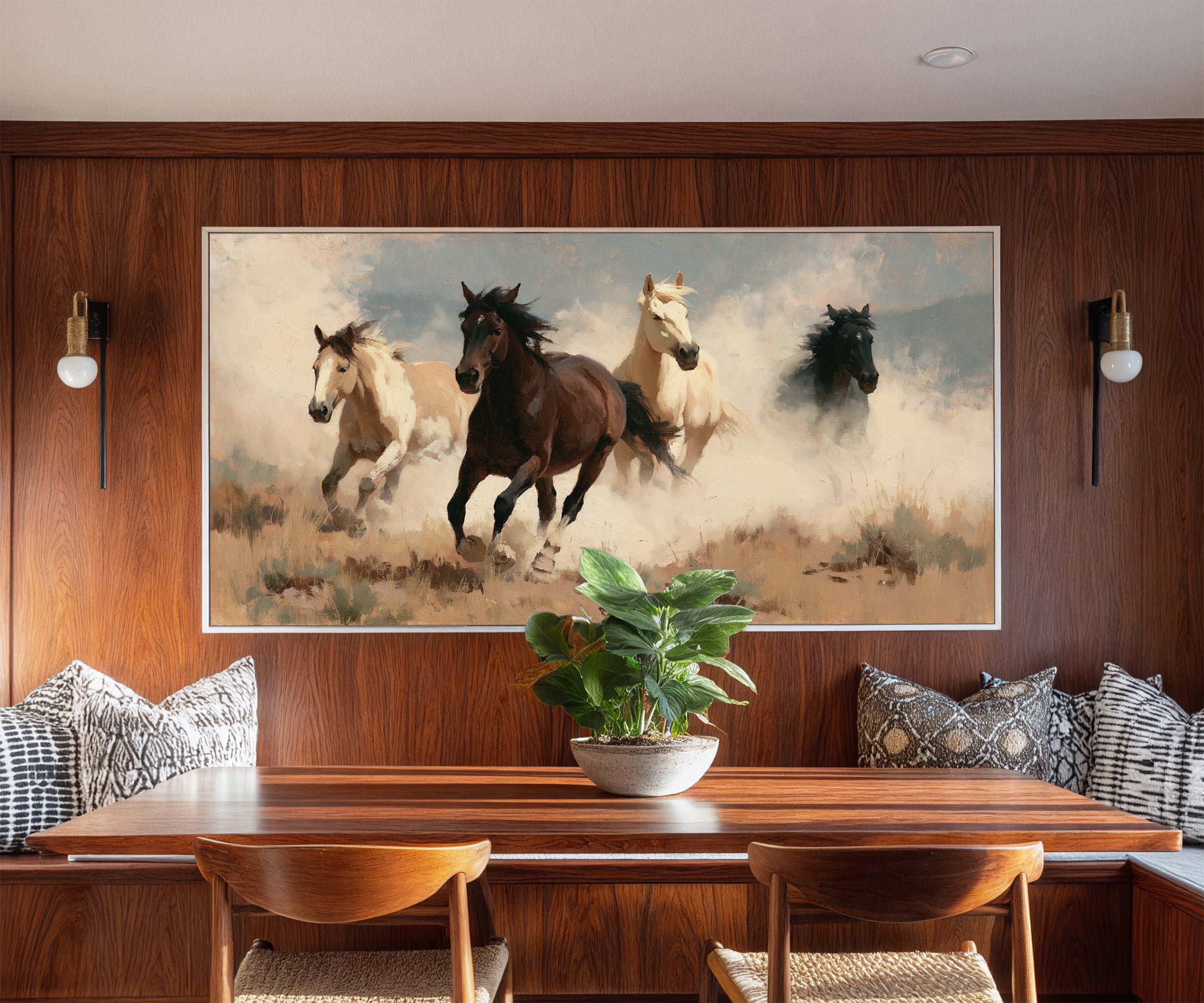 running horses in a dry open field with dust canvas wall art in a white frame in a styled room setting