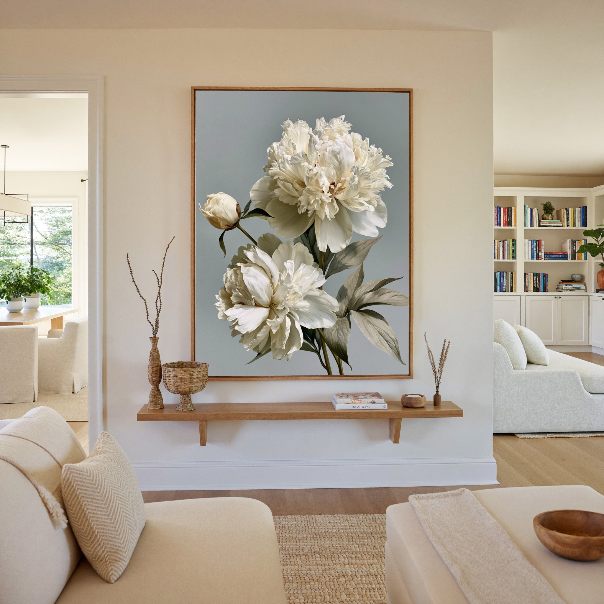 cream peonies with pale green leaves canvas wall art in an oak frame in a living room
