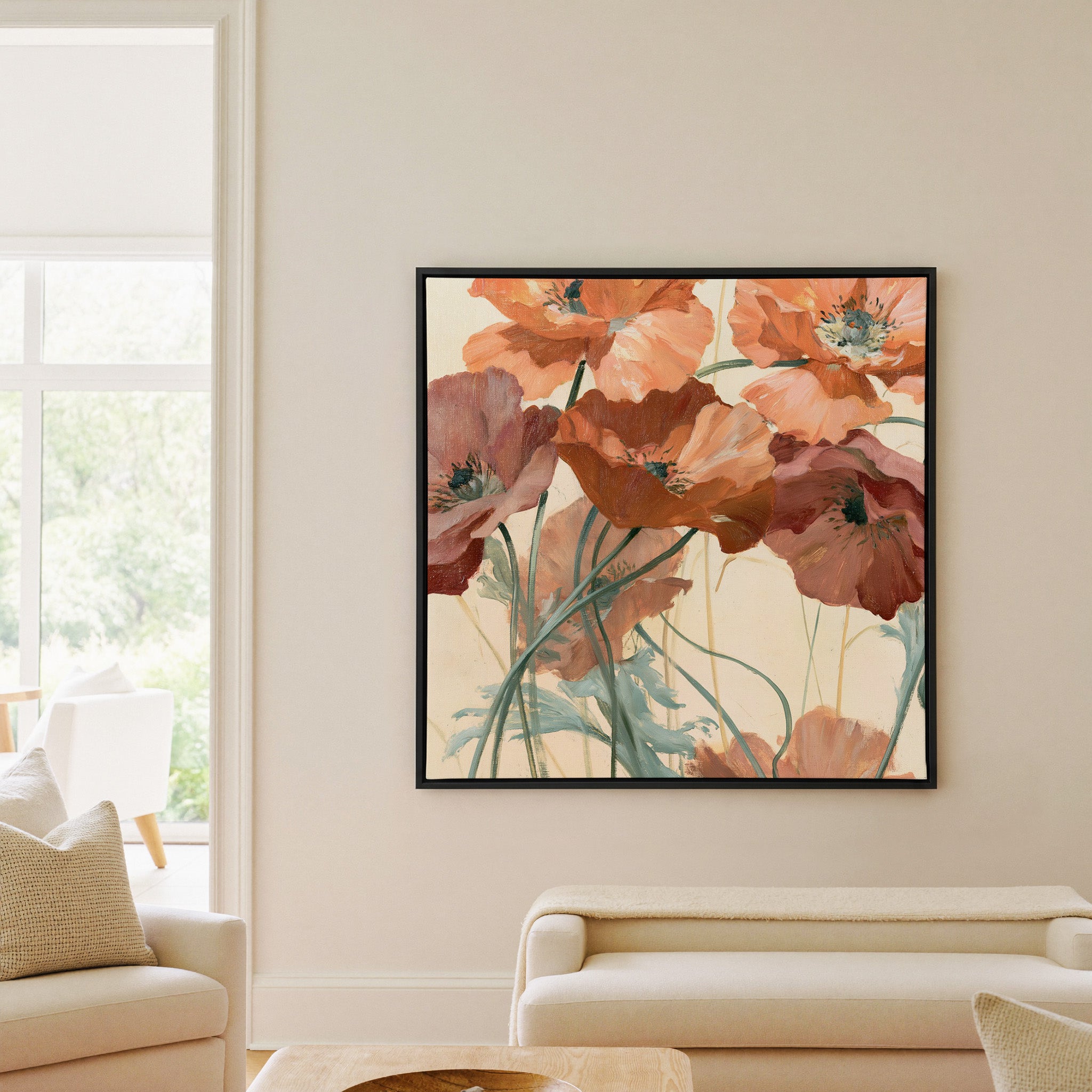 apricot and rust poppy flowers with thin green canvas wall art in a black frame in a living room
