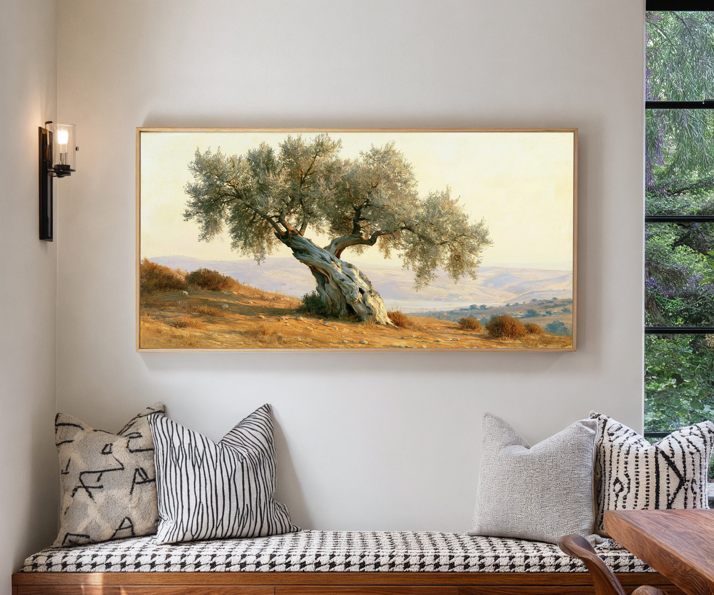 solitary olive tree on dry mediterranean hills canvas wall art in a natural wood frame in a living room