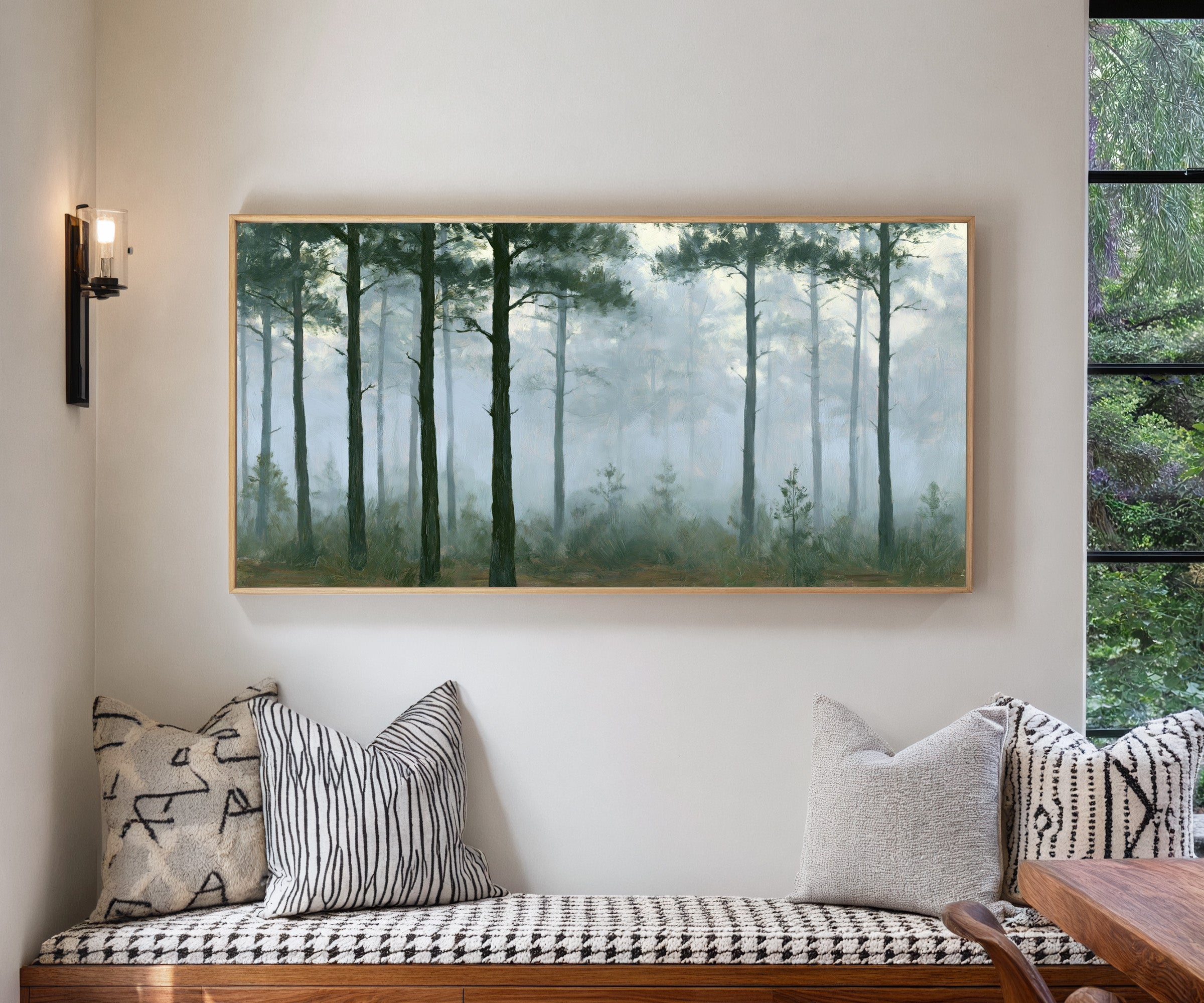 tall pines in pale morning mist canvas wall art in a natural wood frame in a living room