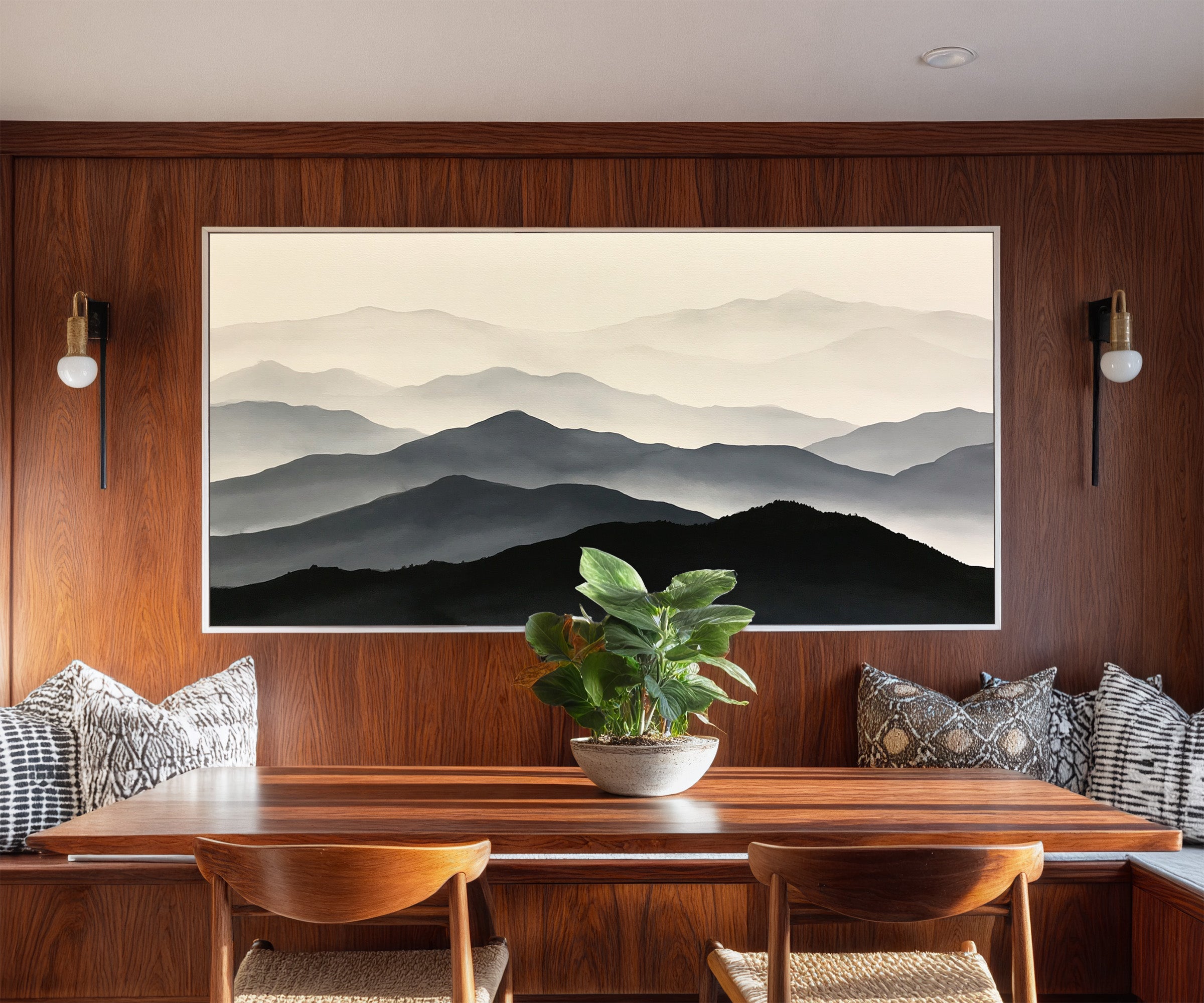 layered mountain ridges in black and gray canvas wall art in a white frame in a styled room setting