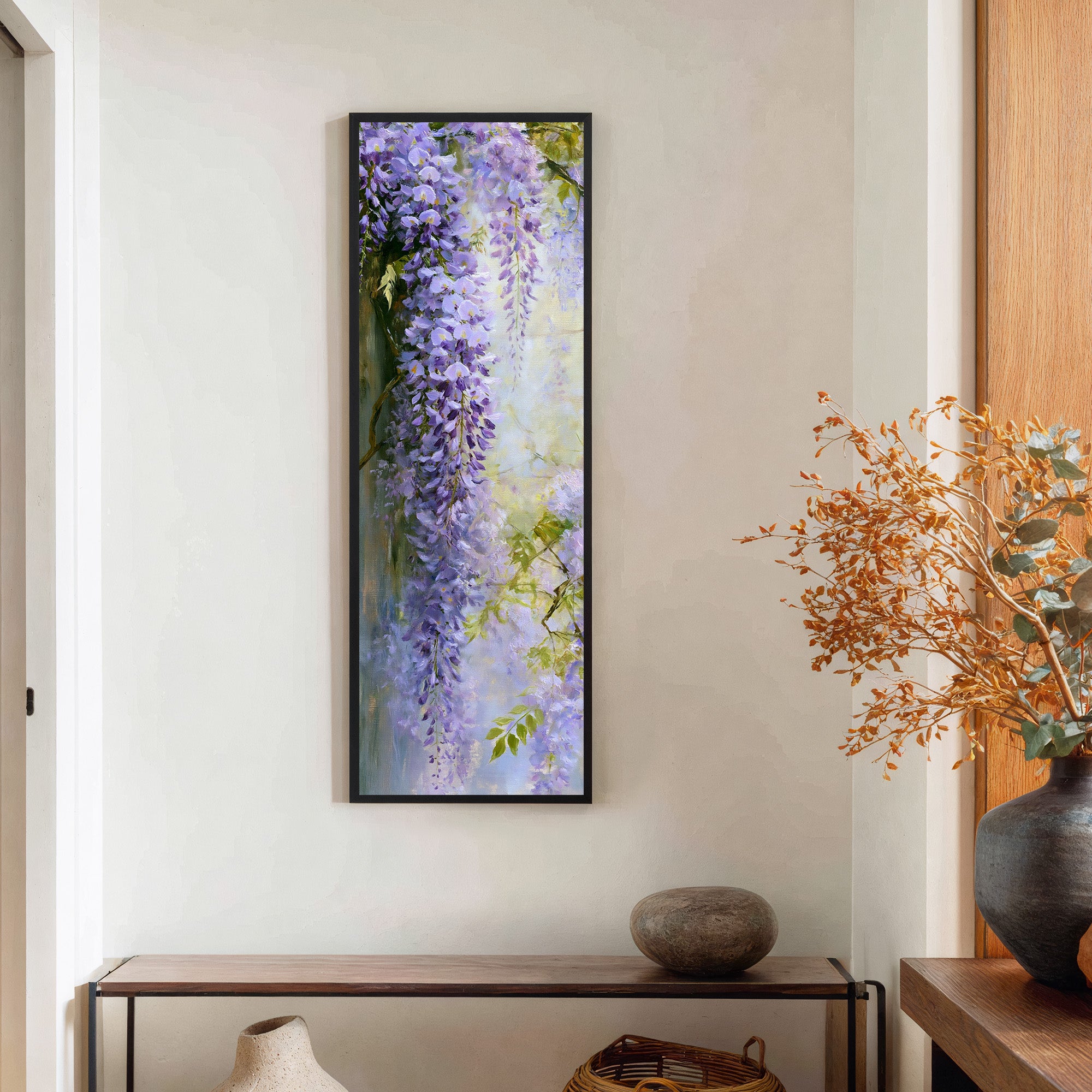 cascading lavender wisteria against a pale canvas wall art in a black frame in a styled room setting