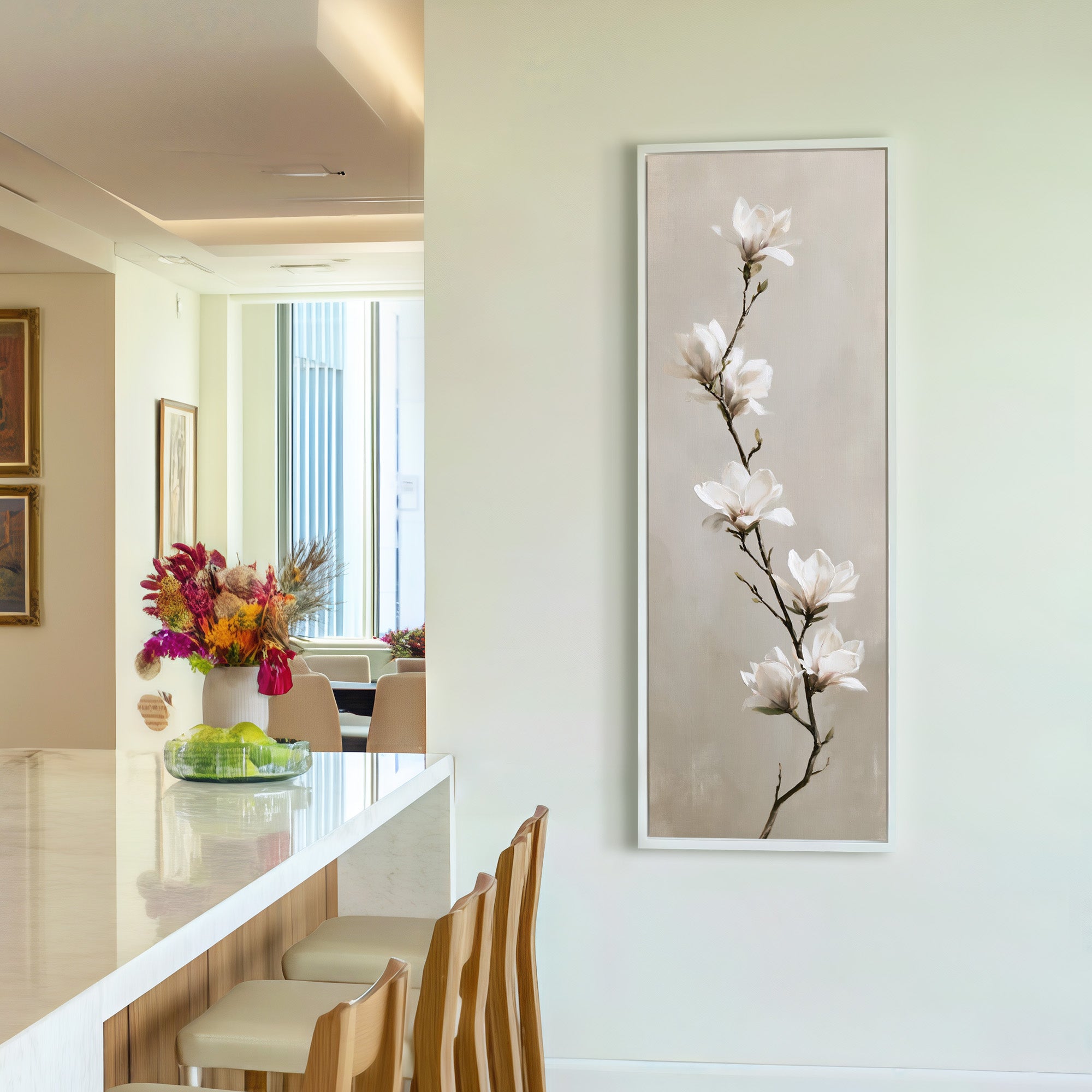 single white magnolia branch on a soft beige canvas wall art in a white frame in a styled room setting