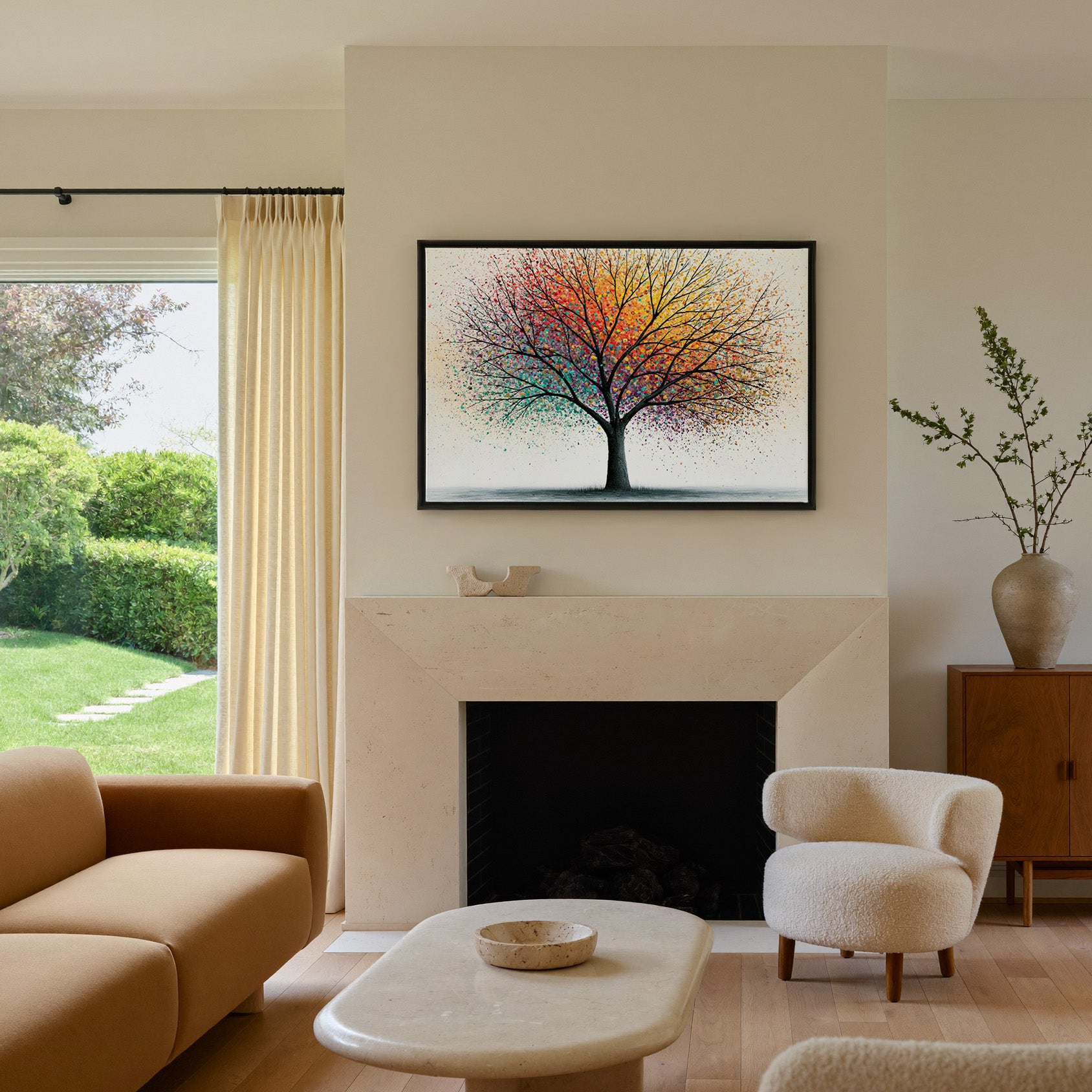 bare tree with multicolor spray canopy canvas wall art in a black frame above a mantel