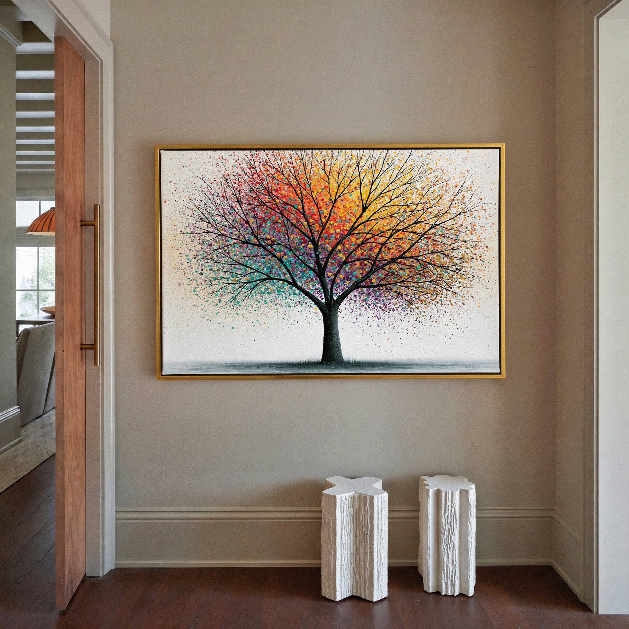 bare tree with multicolor spray canopy canvas wall art in a gold frame in a styled room setting