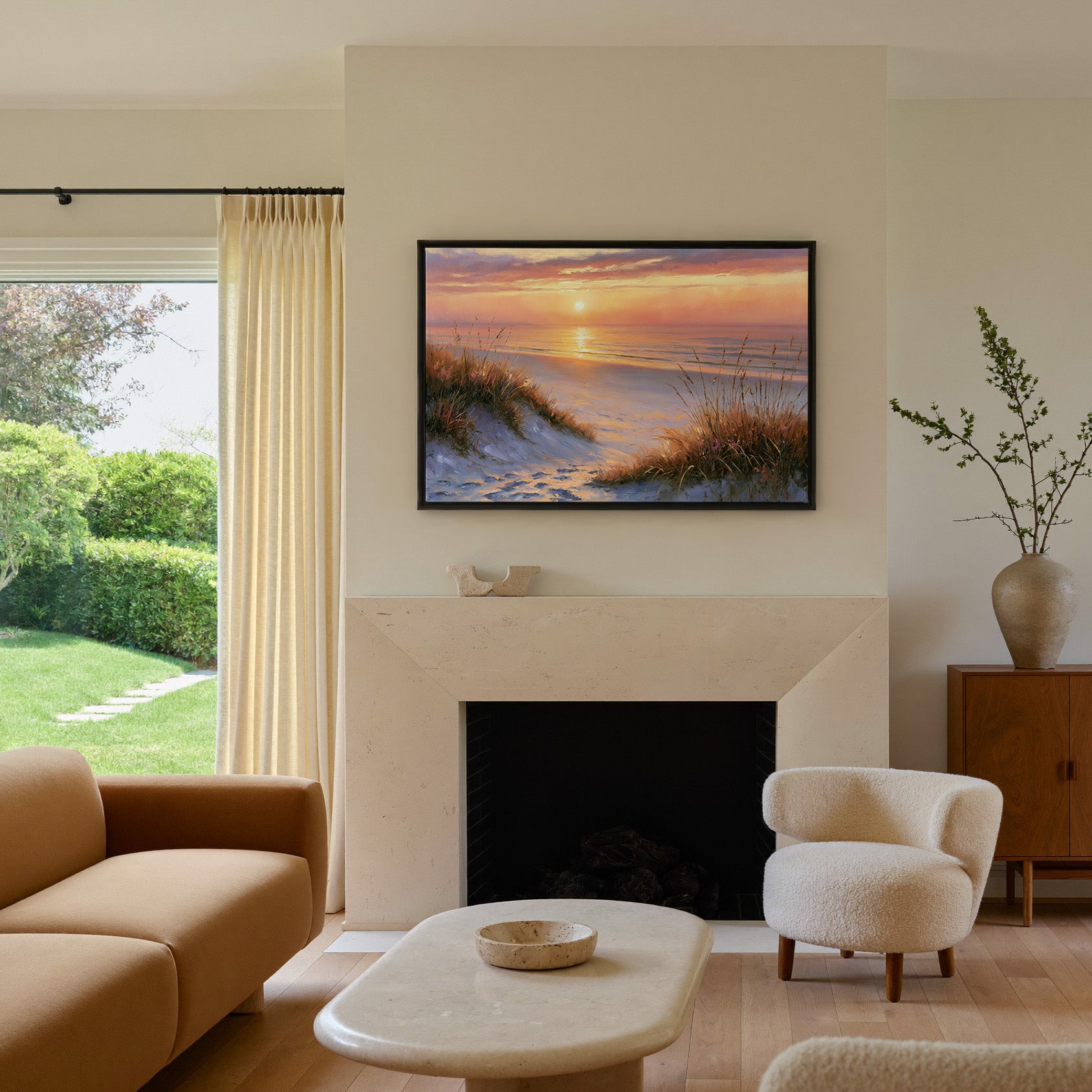 golden hour beach with dune grass and a calm sea canvas wall art in a black frame above a mantel