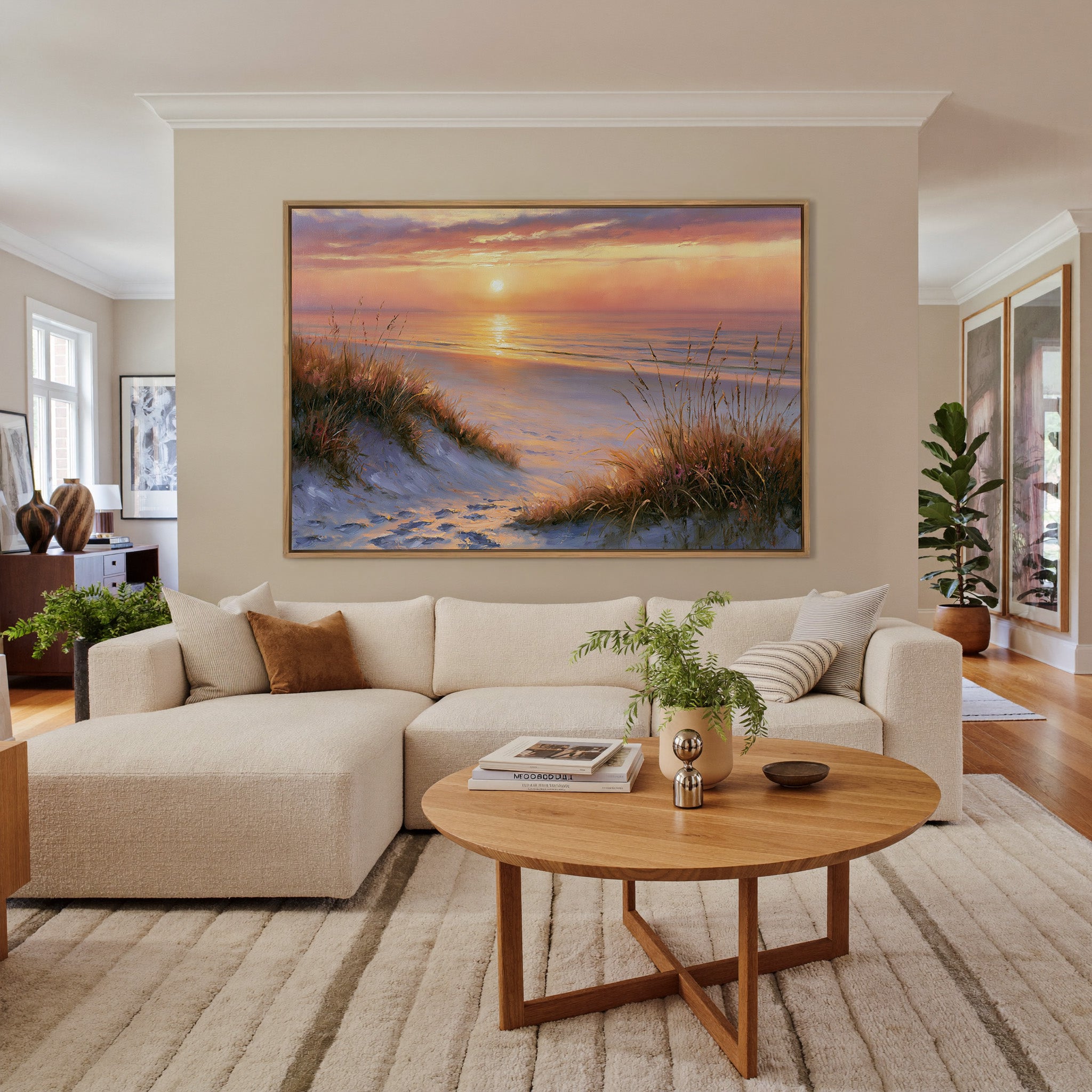 golden hour beach with dune grass and a calm sea canvas wall art in an oak frame in a living room