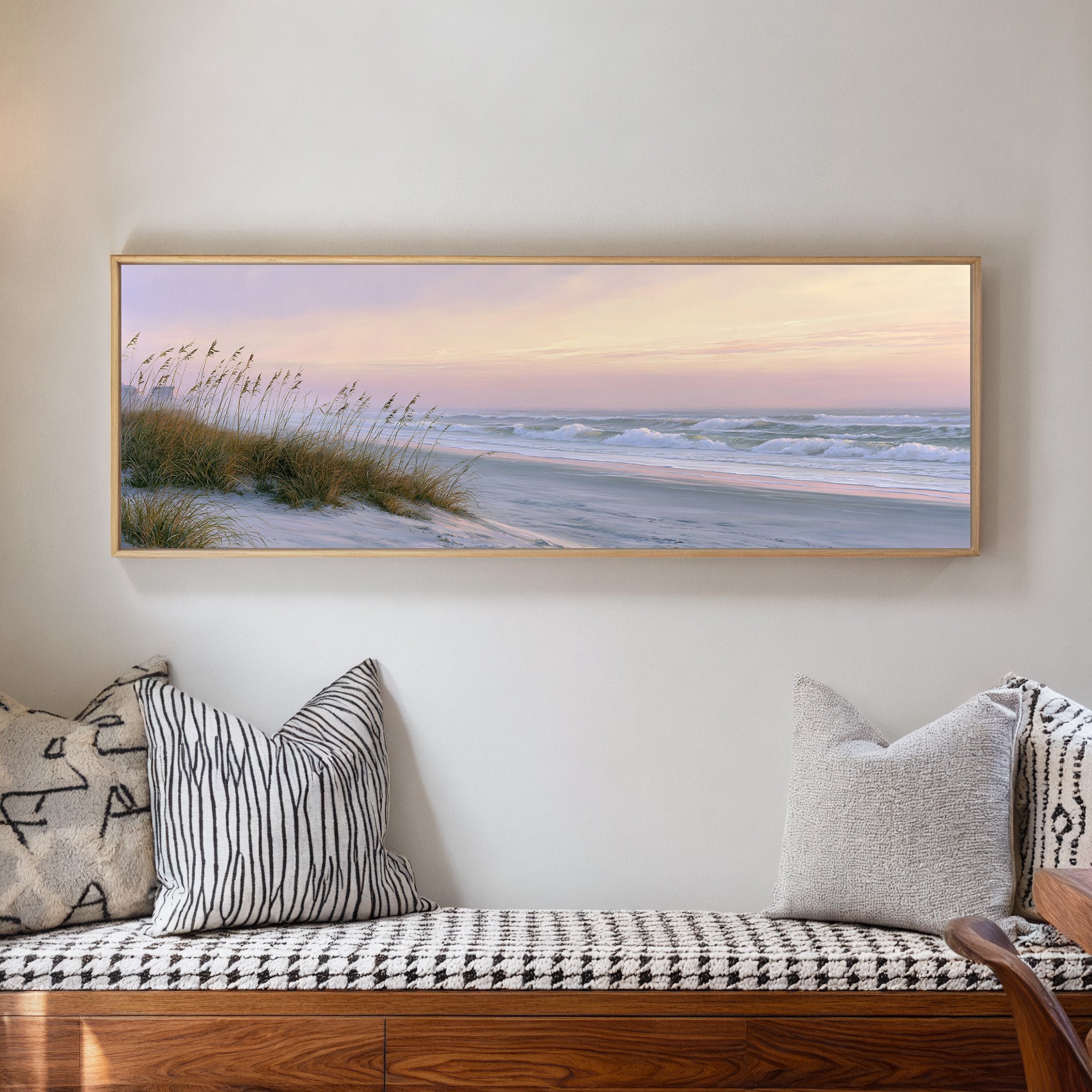 windswept beach at dusk with pale surf and dune canvas wall art in a natural wood frame in a living room