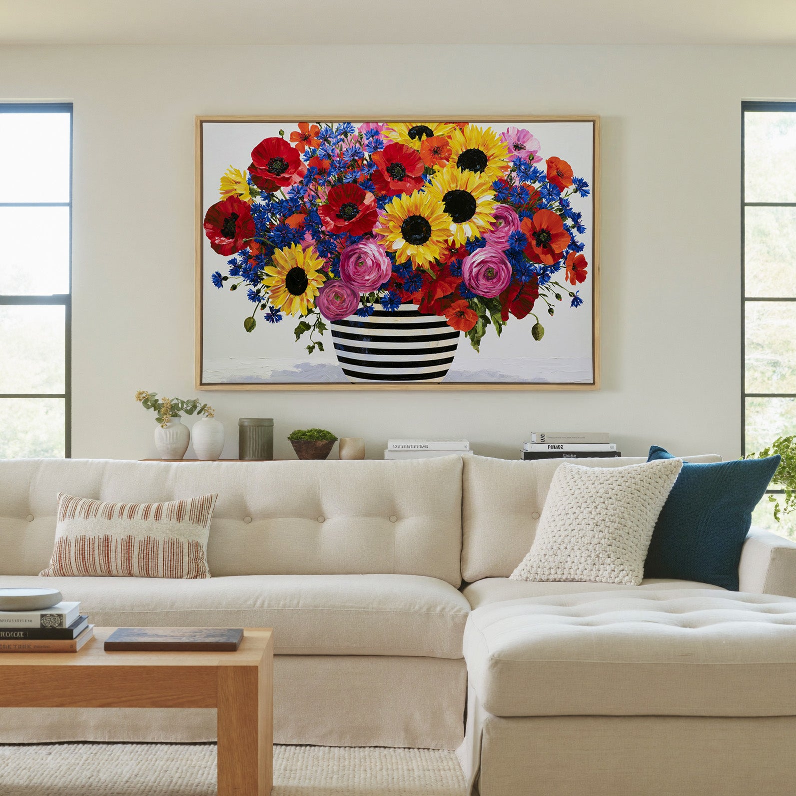 colorful bouquet with striped vase canvas wall art in a natural wood frame in a living room