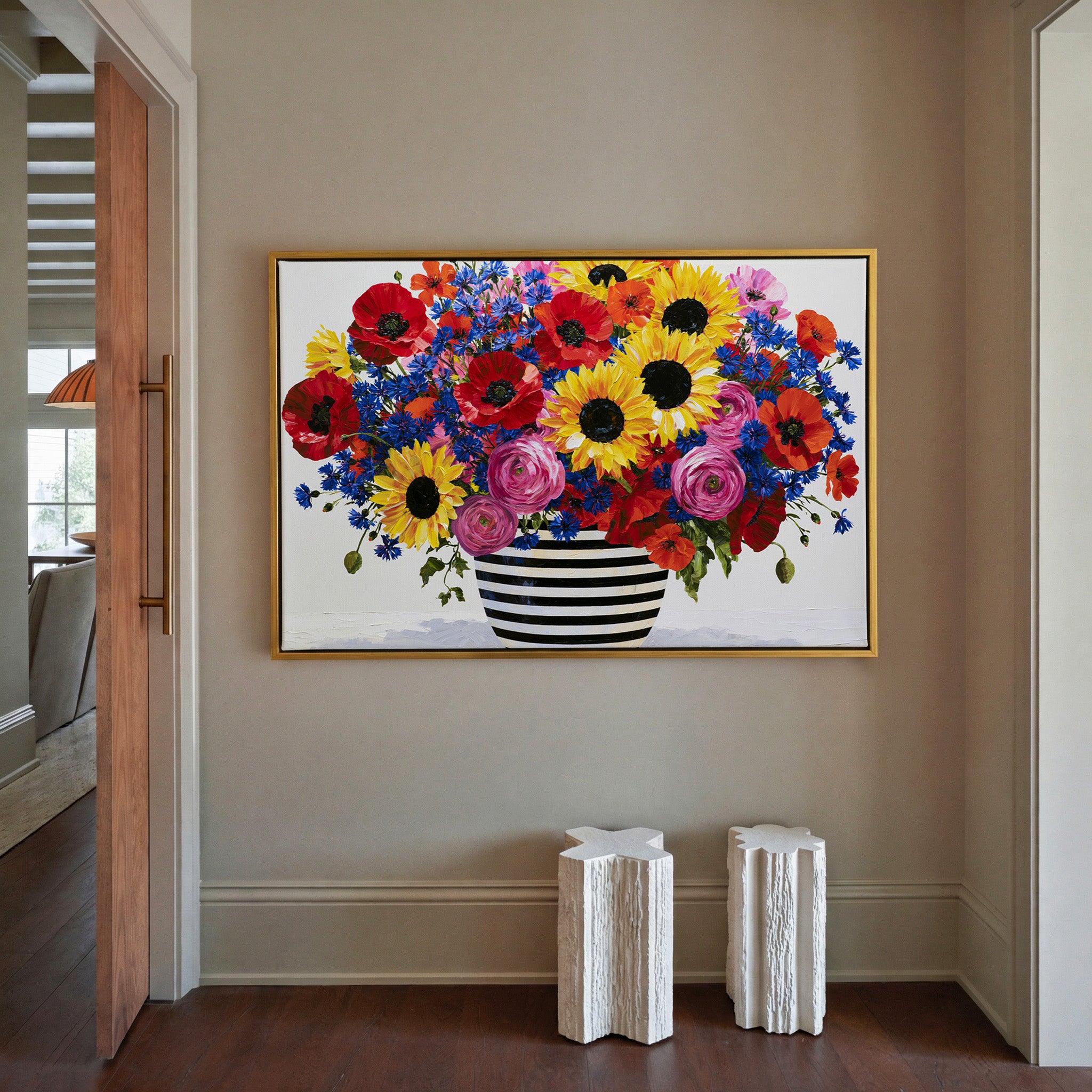 colorful bouquet with striped vase canvas wall art in a gold frame in a styled room setting