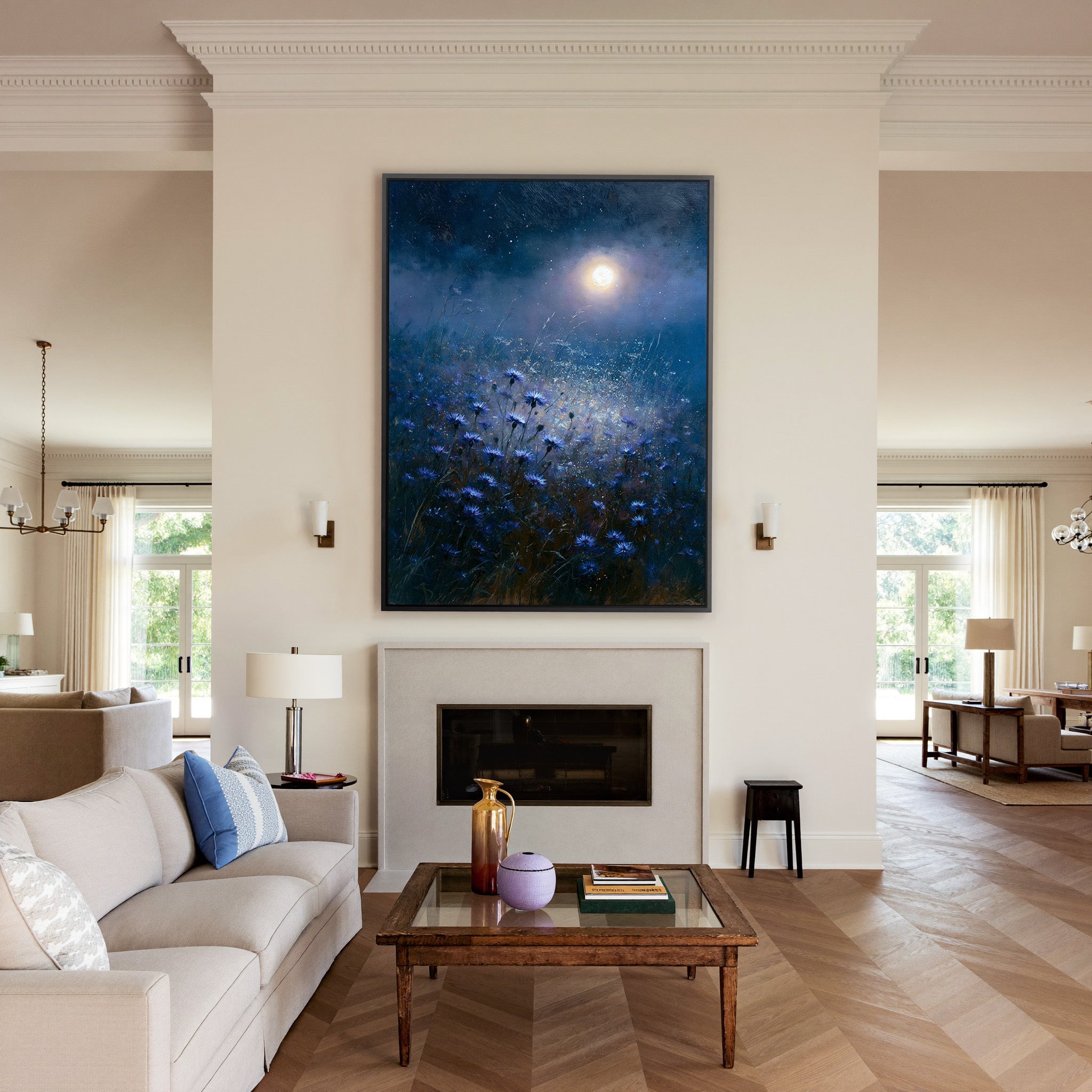 moonlit blue meadow with scattered cornflowers canvas wall art in a black frame above a mantel