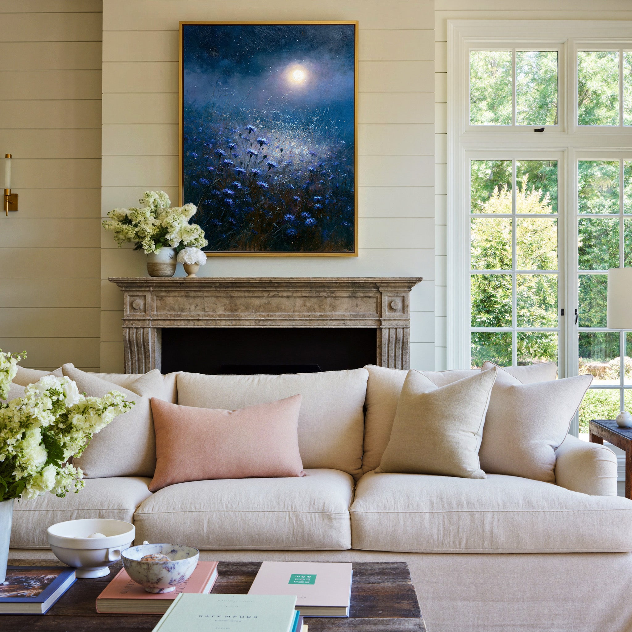 moonlit blue meadow with scattered cornflowers canvas wall art in a gold frame above a mantel