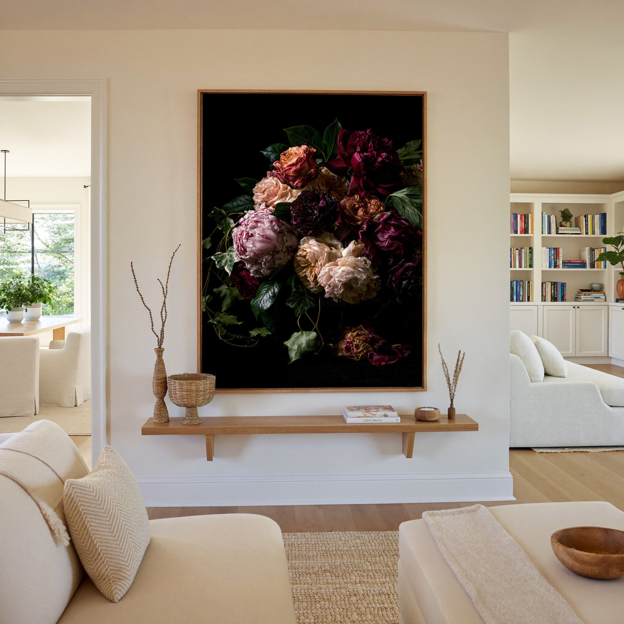 dark floral bouquet with burgundy, blush, and canvas wall art in an oak frame in a living room