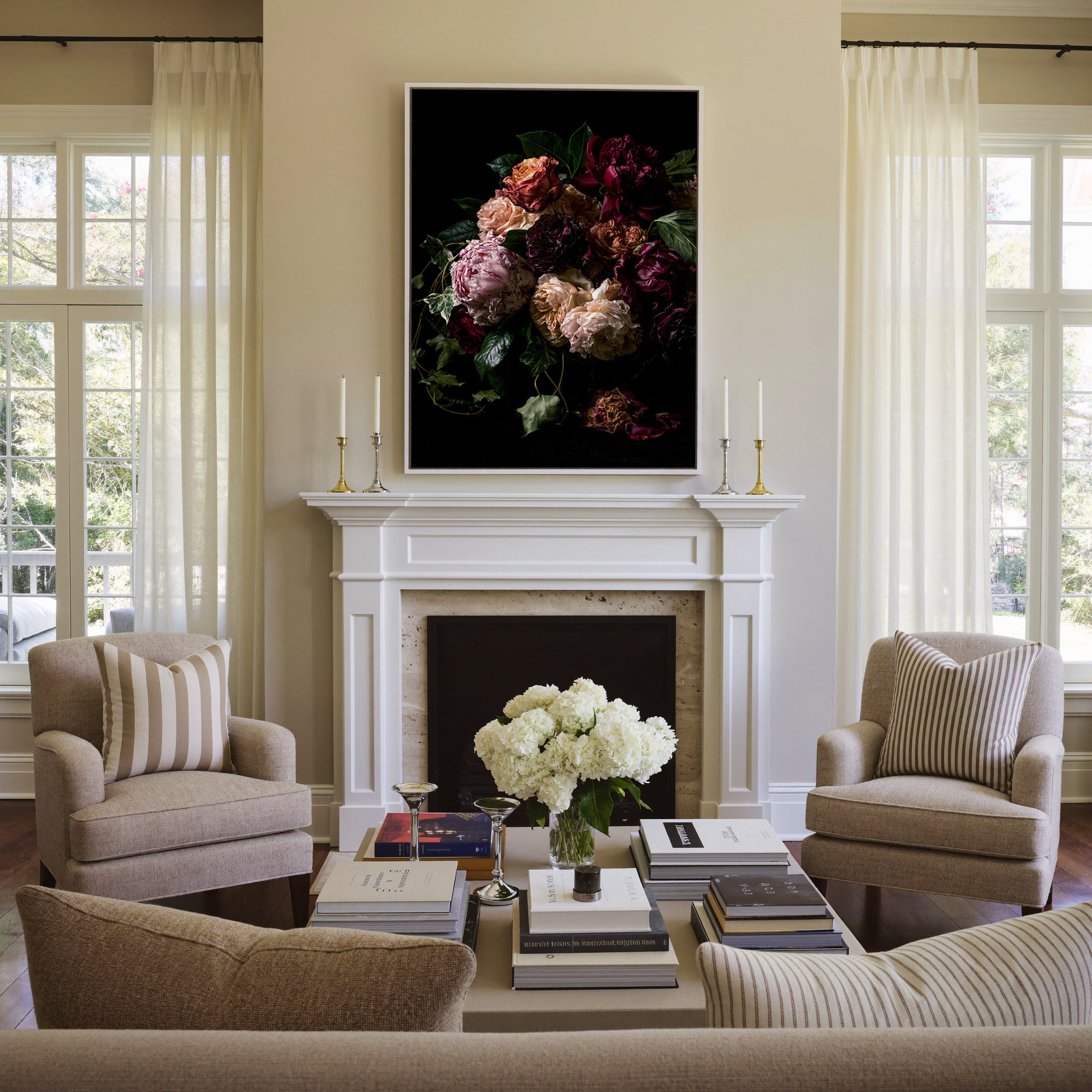 dark floral bouquet with burgundy, blush, and canvas wall art in a white frame above a mantel