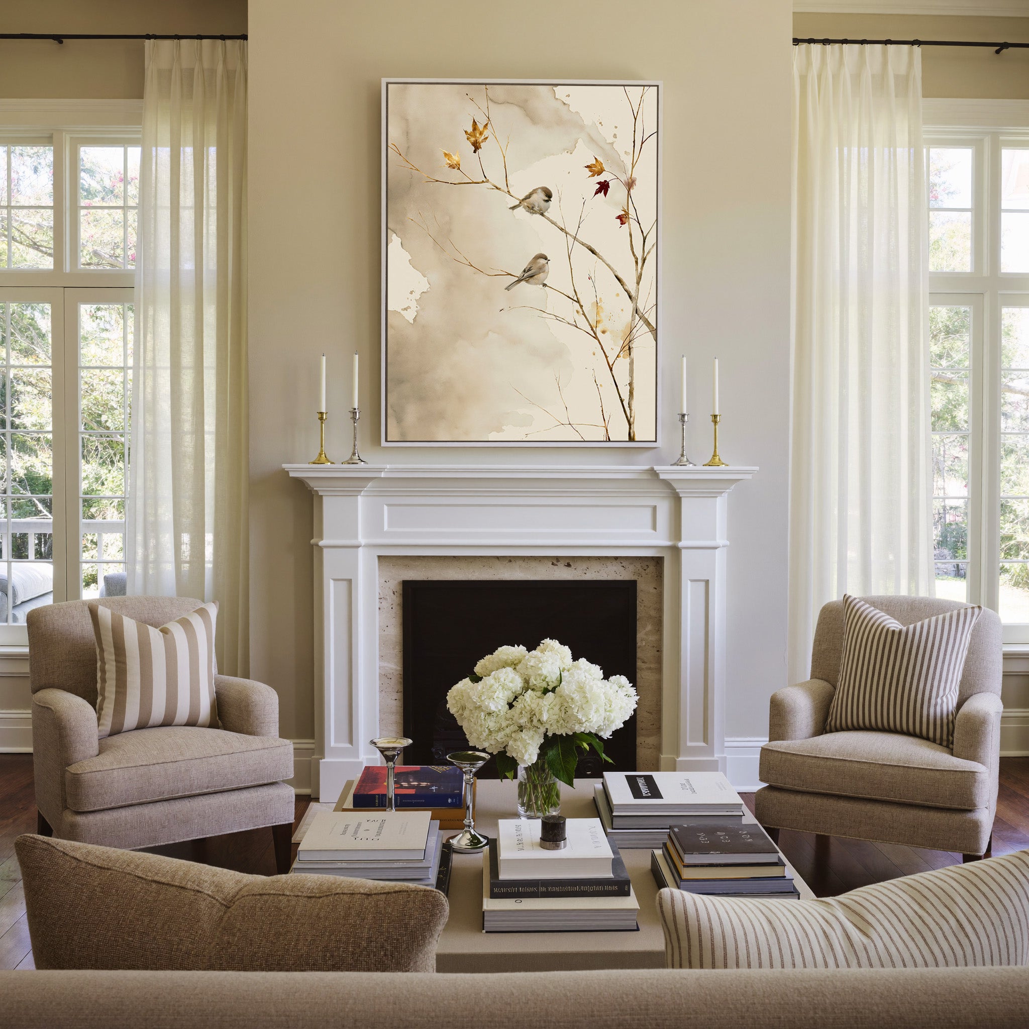 pair of small songbirds on bare autumn branches canvas wall art in a white frame above a mantel