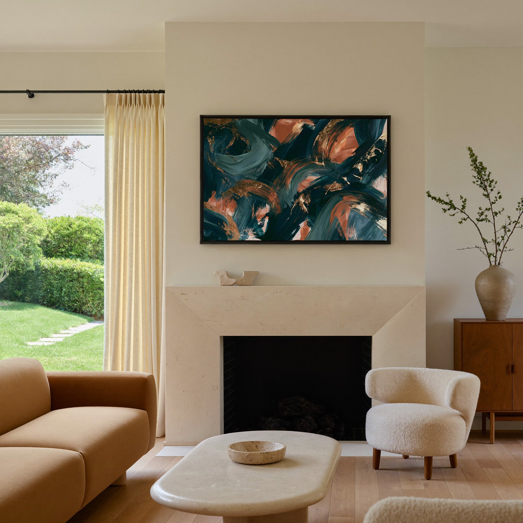 teal and copper abstract with sweeping arcs canvas wall art in a black frame above a mantel