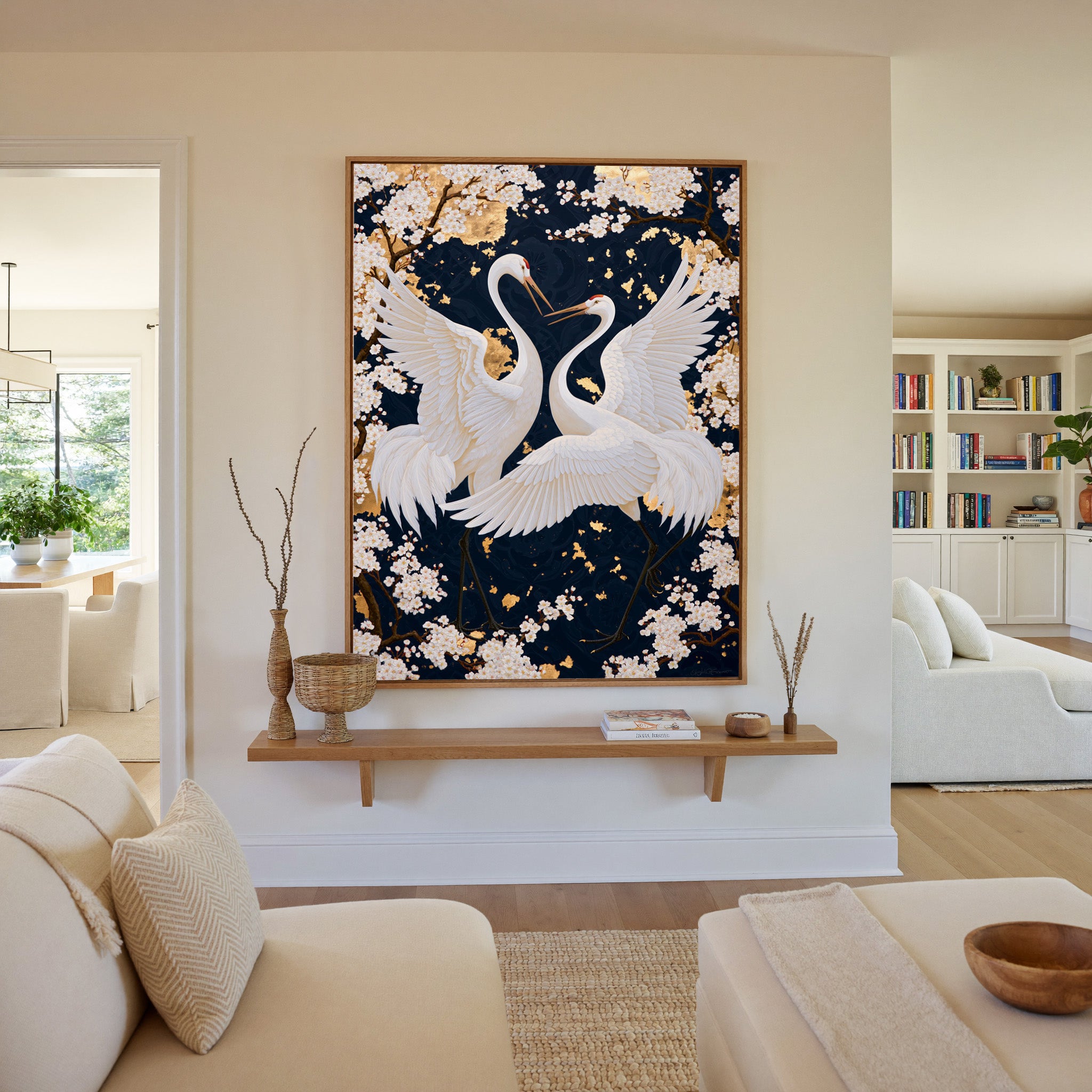 white crane pair among cherry blossoms on a canvas wall art in an oak frame in a living room