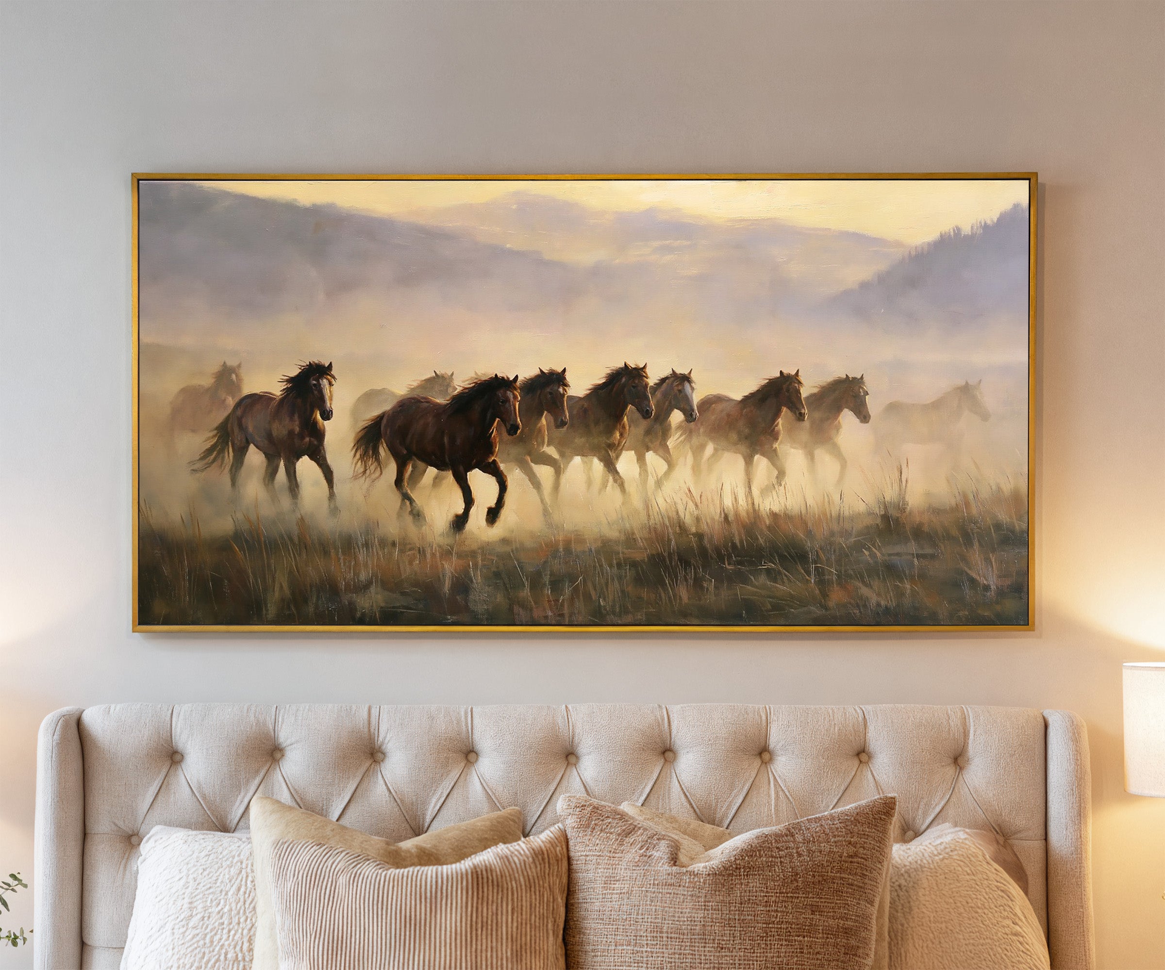 misty mustang herd at sunrise canvas wall art in a gold frame above a bed